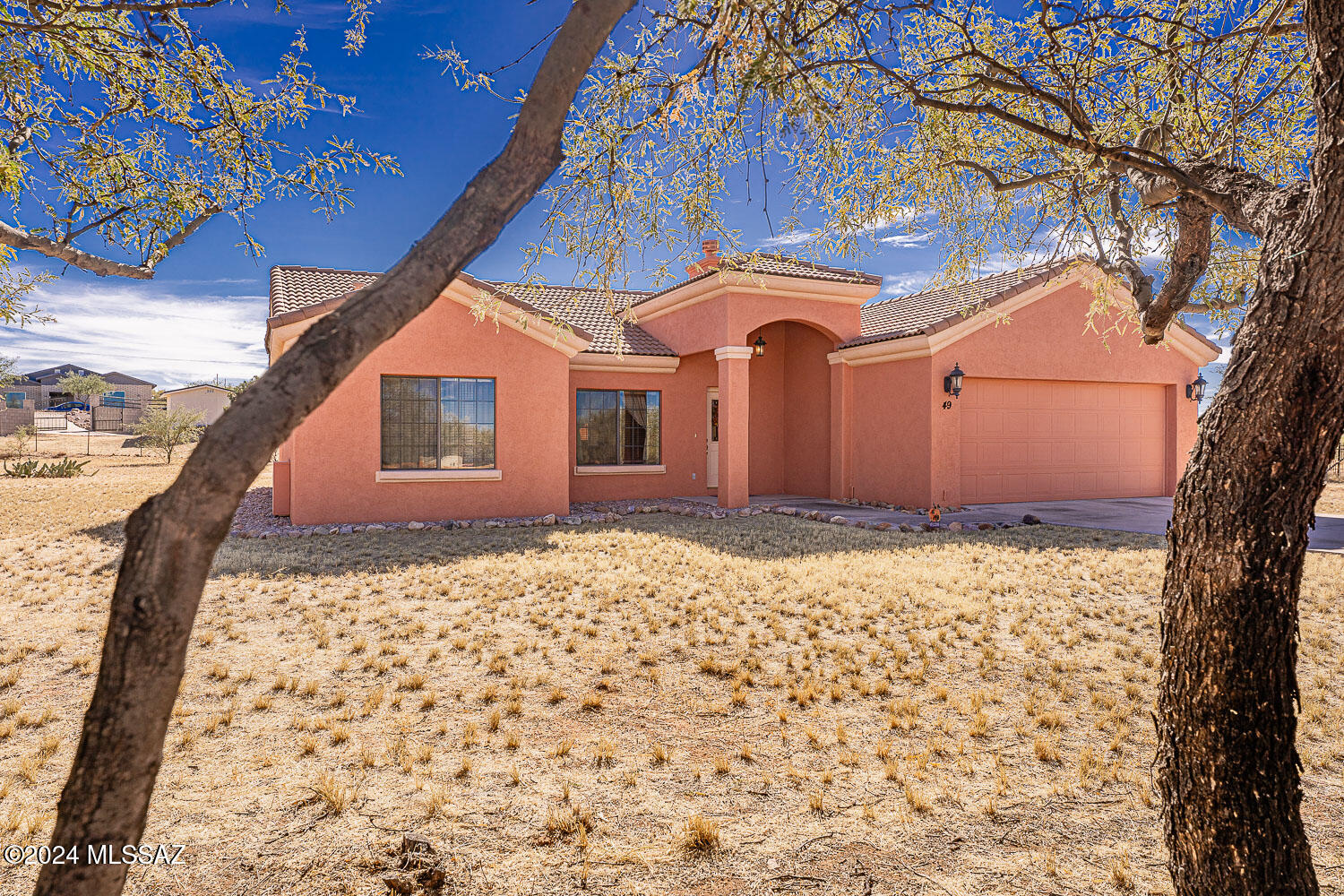 If tranquility,peace and quiet,and elbow room are on your list, stop the car - you have arrived! You'll have beautiful views of the mountains and can enjoy the sunset from your back patio. Burn off the chill this winter with the wood burning fireplace for a cozy ambiance. The moveable island for the kitchen is currently in a corner serving as a dry bar. The lighted niche in the hallway leads you to the 2 guest rooms. The 3rd bedroom could easily accommodate your den, office or hobby room. The home has a 3-stage water filtration/softener system installed in Oct. '23; Exterior painted March '23. The garage is extra deep (22') to accommodate a truck, and the garage door is extra wide (18'). 8'' masonry block and 2x4 construction make this home very energy efficient for years to come.