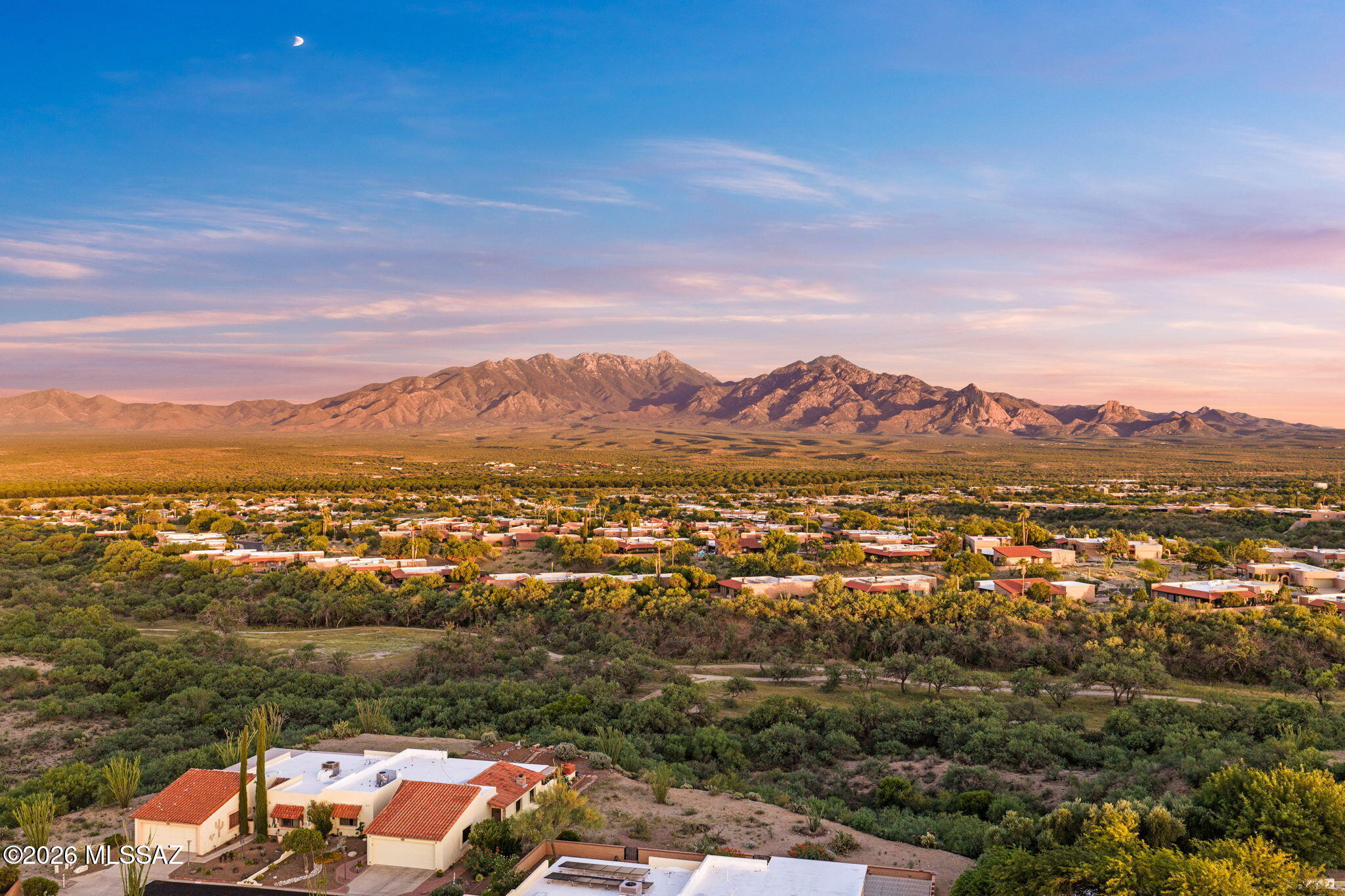 Mountain Views Like This Don't Come Around Often! Step into the living room and take in sweeping, unobstructed views of the Santa Rita Mountains with the Canoa Hills walking area unfolding below. With no houses directly behind you, the privacy here is real and the view is the kind buyers dream about in Green Valley. Watch golden sunrises, fiery sunsets and dramatic summer storms roll across the mountains from the living room or from your covered back patio retreat, an ever changing backdrop that never gets old. This meticulously maintained home is squeaky clean and move in ready, with a beautifully updated kitchen featuring SS appliances including a new stove, microwave and dishwasher, along with tastefully updated cabinets and Corian counters. Bathrooms have also been updated with higher Corian counters and an LG washer and dryer are included. The oversized garage is a true standout, complete with heat and air conditioning and durable epoxy flooring, an ideal space for a workshop, hobby studio or simply pampering your vehicles in comfort. Electric has already been upgraded, so bring your hot tub and soak in those mountain views even more. And the crowning touch: paid for solar, offering effortless energy savings for years to come. Homes on this street are rarely offered for sale. This is a genuine opportunity to own one of the most coveted views in the neighborhood.