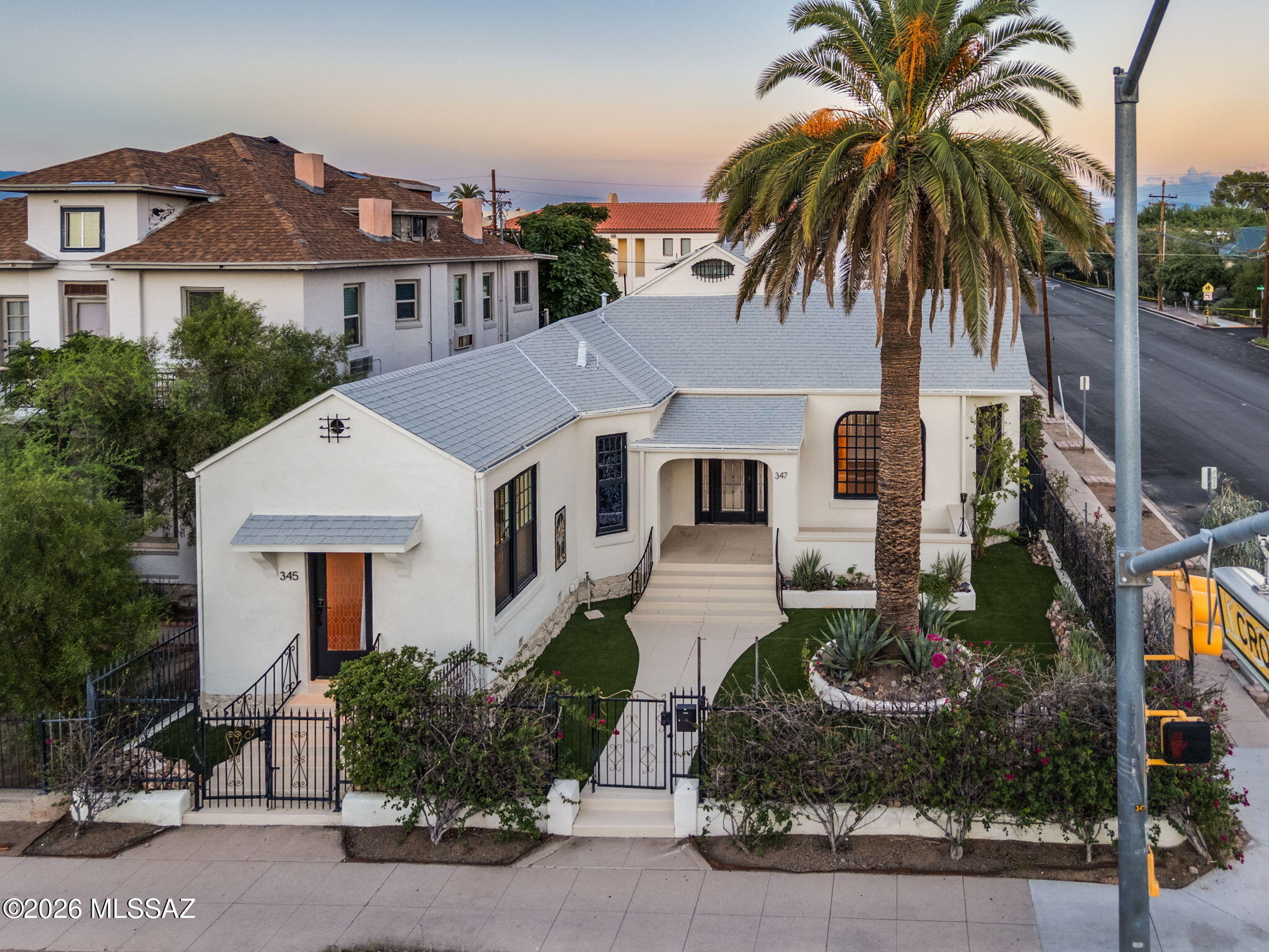 One-of-a-kind, beautifully restored 1903 historic gem in highly desirable Armory Park, just south of Downtown Tucson! This light-filled home showcases original hardwood floors, soaring ceilings, wood windows, architectural details, a carved marble fireplace, 3 bedrooms + office, 2 restored clawfoot tubs, spacious living and dining areas, with an updated kitchen. The separate 1BD/1BA guest house with full kitchen has a successful Airbnb history. C-3 zoning offers incredible flexibility for residential, home business, Airbnb, or a combination. Enjoy 3 outdoor living spaces, mature desert landscaping, a private backyard, and detached 2-car garage/workshop. Walk Score 89 & Bike Score 100--an exceptional location and truly unique property!