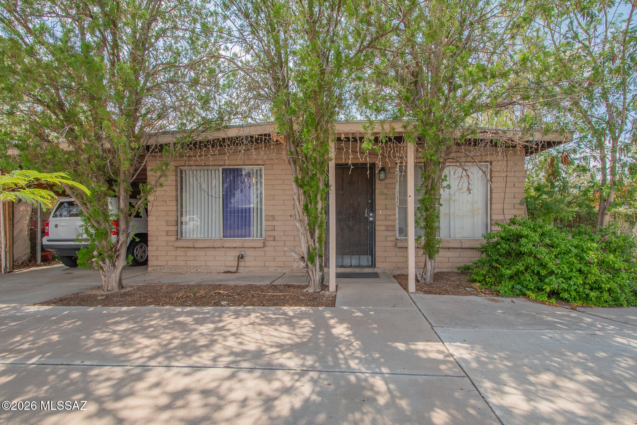 AS-IS investor special! Spacious 2,269 sq ft home featuring 5 bedrooms and 3 full bathrooms in a convenient location with no HOA. The permitted primary suite addition has a separate entrance, a large handicap-convertible ensuite bathroom, and a bonus/living room, offering potential for an income property or multigenerational living. The second primary suite in the main portion of the home also features an ensuite bathroom with walk-in shower and large bonus room. Close proximity to I-10, Tucson International Airport, Davis-Monthan Air Force Base, downtown Tucson, schools, shopping, dining, and more. Cash only. Seller will make no repairs. Bring all offers - seller requests property is viewed in-person prior to offer submission.