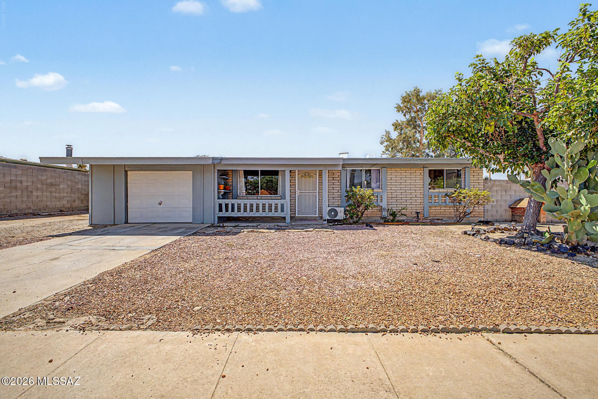 Discover this inviting 3-bedroom home featuring low-maintenance landscaping, an attached garage, and a welcoming covered porch. Inside, discover a bright living room with carpeting and an eat-in kitchen with plentiful storage and generous counter space. The primary bedroom includes a private bathroom for added comfort. The convenient laundry room is located inside the garage. Step outside to an expansive backyard with a covered patio, offering endless possibilities to create your own desert oasis. Perfectly situated near restaurants, schools, and major roads. This charming residence combines comfort, convenience, and creative potential. Don't miss out!