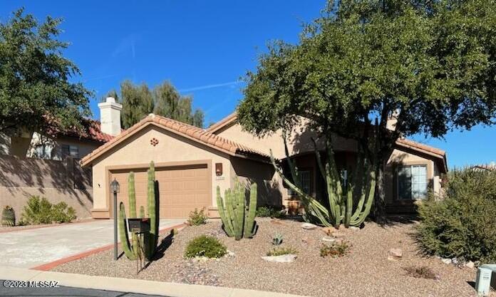 TUCSON NATIONAL HOME, Gated Community, Unfurnished, Elevated Lot backing Golf Tee with Nice Mountain Views!  Two Bedroom PLUS DEN, Two Bath. Enjoy the  Hot Tub, Fire Pit, Private rear yard with Views! Upgraded Kitchen with Gas Oven/Range, STAINLESS appliances, GRANITE Counter Tops, Rich Cherry Cabinets, Large Living room AND Family Room separated with 2-Way Fireplace! GATED Community. NO CARPETING: Saltillo Tile and Wood Flooring throughout. Pets with owners' permission. Contact Listing Broker for your personal showing today!