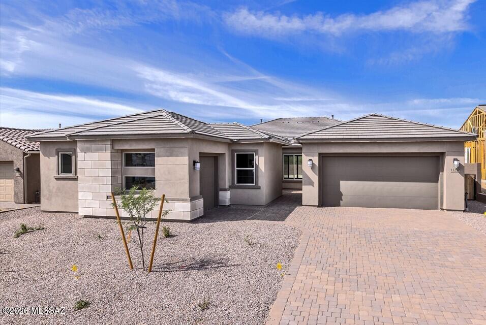 Anticipated for move-in April 2026, this beautiful home features a desirable split floor plan and a contemporary exterior accented with driveway and walkway pavers. Inside, you'll find a chef-inspired kitchen with a gas cooktop, stainless steel Whirlpool appliances, upgraded Linea Black full-overlay cabinetry, enhanced drawer construction, and elegant Citrine Quartz countertops. The owner's bath offers a framed, low-threshold walk-in shower and matching Citrine Quartz counters.

Don't miss the chance to own this stunning home.