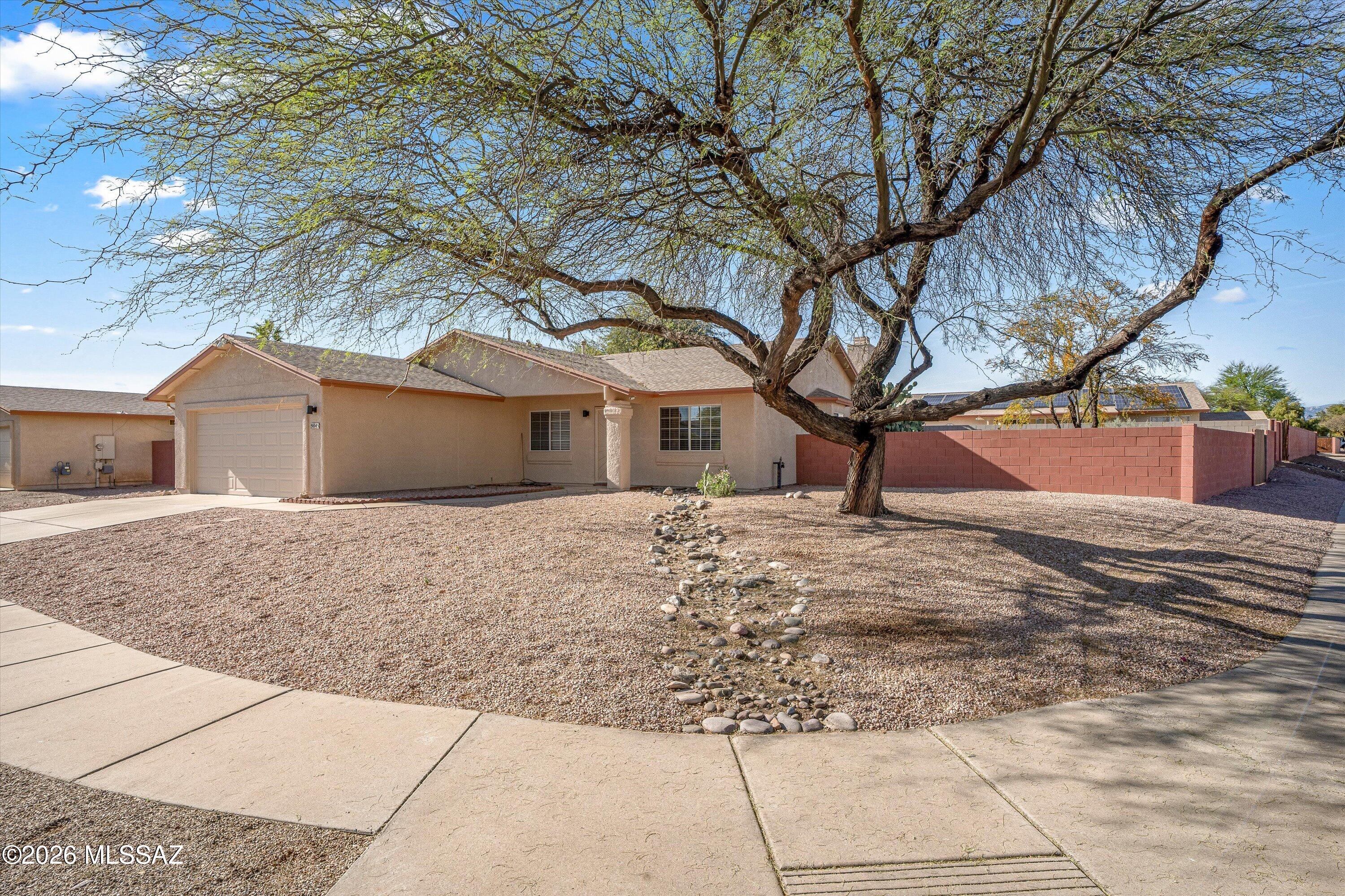 Beautiful 4-bedroom, 2-bath home featuring a desirable split-bedroom floor plan and numerous upgrades throughout. The updated kitchen includes oak cabinetry and stainless steel appliances, including a refrigerator, dishwasher, and smooth-top Whirlpool oven. Enjoy a spacious living area with high vaulted ceilings and a cozy wood-burning fireplace. Interior highlights include ceramic tile flooring in main areas, new carpeting in bedrooms, fresh interior paint, and ceiling fans throughout.
The primary suite offers a walk-in closet and an en-suite bath with dual sinks and a tub/shower combination. Additional features include a laundry room with gas or electric dryer hookups, newer HVAC system, updated electrical service, and a shingle roof. Corner Lot.
