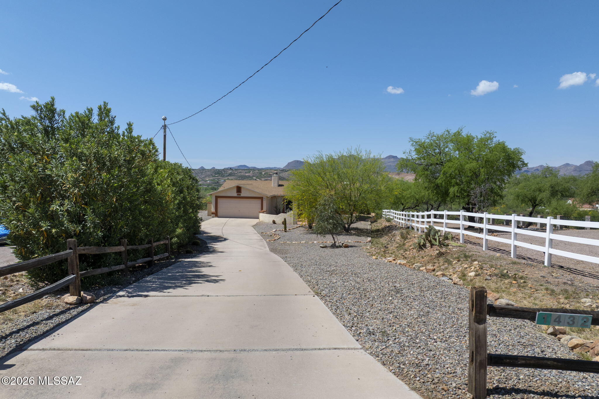 If you are looking for a charming home in an amazing location with indescribable views, your search ends here! As you arrive, you'll be welcomed by a lengthy concrete driveway leading to this delightful 3 Bedroom, 2 Bath home. The great room features a cozy fireplace, perfect for gatherings. Enjoy the Arizona room, where you can relax and take in the serene green pastures. The property is beautifully landscaped, boasting both a front yard fountain and a backyard fountain. A fireplace in the backyard allows you to fully appreciate the gorgeous views. Don't miss the opportunity to make this exceptional house your home!
