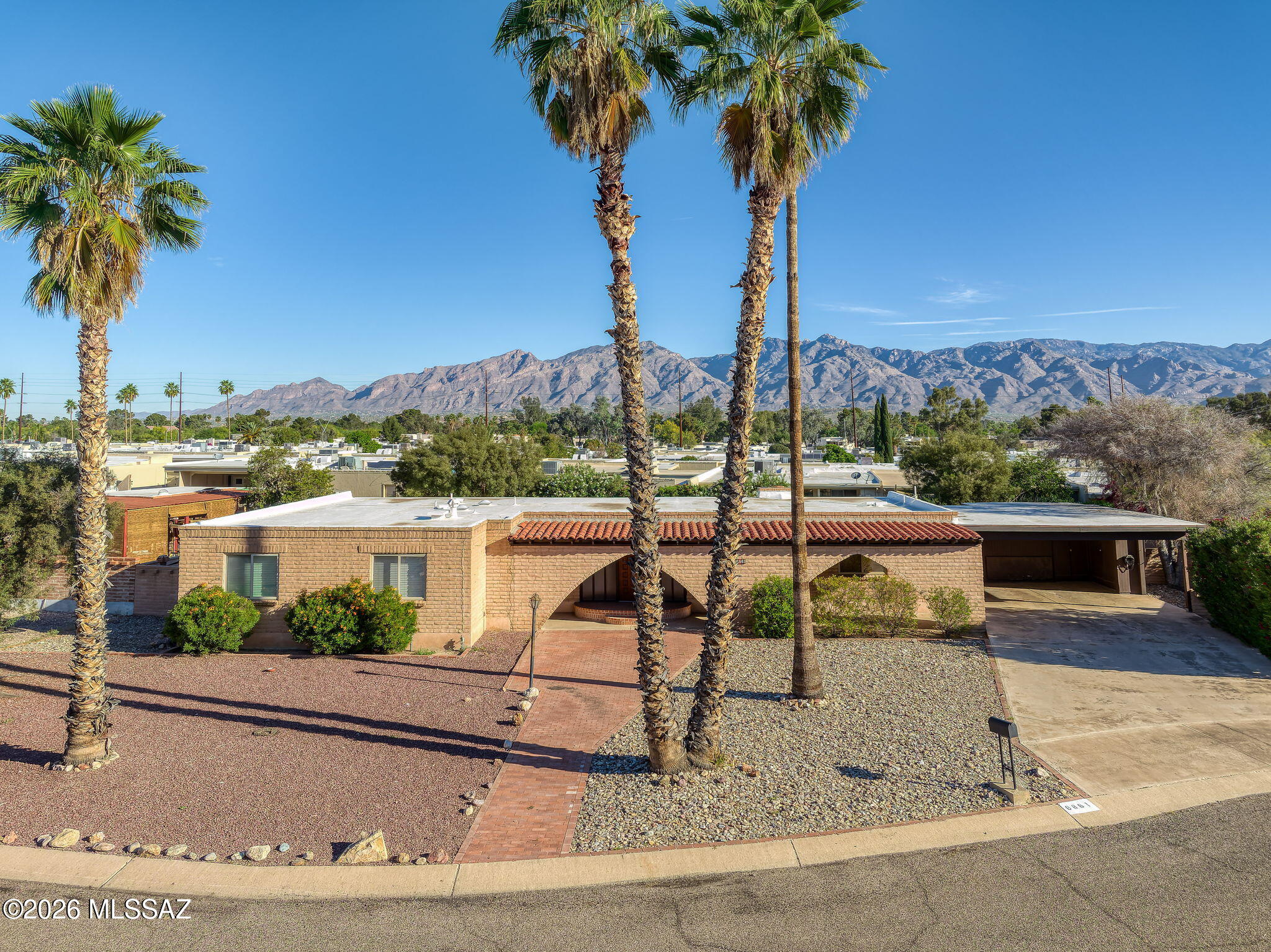 Set on a quiet cul-de-sac in the Dorado Hills subdivision, this updated East Tucson home offers privacy, functionality, and mountain views--conveniently located near shopping, dining, and major medical centers.

Outdoor living is designed for ease and enjoyment, with a private backyard featuring a pool and ample space to relax or entertain. Mountain views can be enjoyed from the covered patio and extend into the living room, creating a natural connection between indoor and outdoor spaces.

Inside, the home offers four bedrooms and two bathrooms with no carpet throughout, along with updated flooring in three bedrooms (2021-2022), fresh interior paint, and new ceiling fans. The main living area is anchored by a gas fireplace, adding warmth and character.

A spacious family room with ex access provides flexibility for guest quarters, a secondary living area, or multigenerational living. An oversized laundry room offers additional space ideal for a home office, studio, or hobby area.

Additional highlights include a newer HVAC system (2022) and a storage shed for added convenience.

Located in Dorado Hills--an established East Tucson neighborhood known for its quiet streets and accessibility--this home offers a balanced lifestyle with comfort, flexibility, and proximity to everyday amenities.