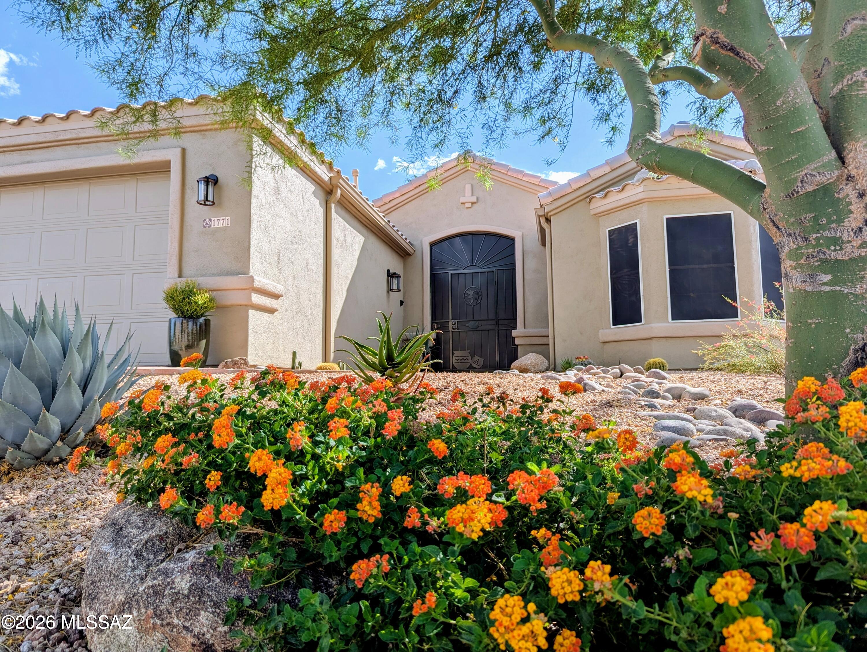 Beautifully designed and meticulously maintained, this stunning home in the coveted Desert Creek neighborhood of Green Valley offers the perfect blend of comfort and style! Featuring 1,645 sq. ft., 2 bedrooms, 2 bathrooms PLUS a den and screened patio, this residence is sure to impress. Enter through a custom security door into a charming exterior entry and step inside to a bright, open great room with soaring vaulted ceilings and abundant natural light. The gorgeous kitchen is thoughtfully appointed with quartz countertops, stainless steel appliances, a spacious island, and a pantry--ideal for both everyday living and entertaining. The spacious primary suite boasts an en suite bath with dual vanities, a separate soaking tub and shower, and a generous walk-in closet. The den offers flexible space for hobbies or a home office. Step outside to enjoy a fully screened patio, and a beautifully landscaped backyard with extended pavers, artificial turf, and a harmonious blend of mature desert landscaping and fruit-bearing trees. Recent updates include a new HVAC system (2024), water heater (2025), and fresh exterior paint (2025). Conveniently located just minutes from shopping, dining, GVR recreation, golf, medical facilities, and easy access to I-19, this exceptional home truly has it all. Select furnishings negotiable on a separate bill of sale.