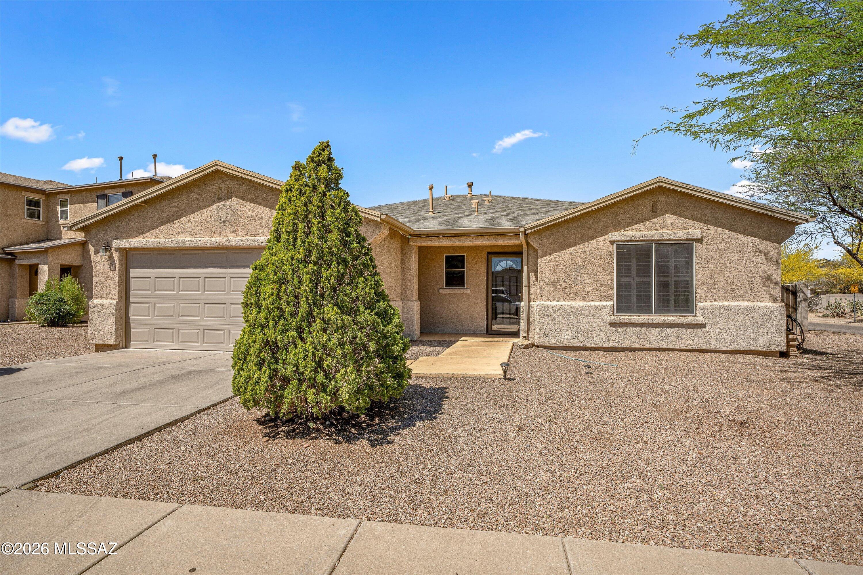 Discover this charming corner lot residence situated in the Julian Ranch Subdivision, conveniently located near I-10, shopping centers, schools, and dining options. This home features three bedrooms, two bathrooms, and a den, all designed with an open-concept kitchen that enhances the living space. Freshly painted walls and new flooring adorn the entrance, kitchen, dining area, and master bedroom, creating a modern and inviting atmosphere. Step outside to the fully landscaped backyard, which offers ample space and the benefit of no rear neighbors, making it an ideal setting for gatherings with family and friends after a busy day at the office.