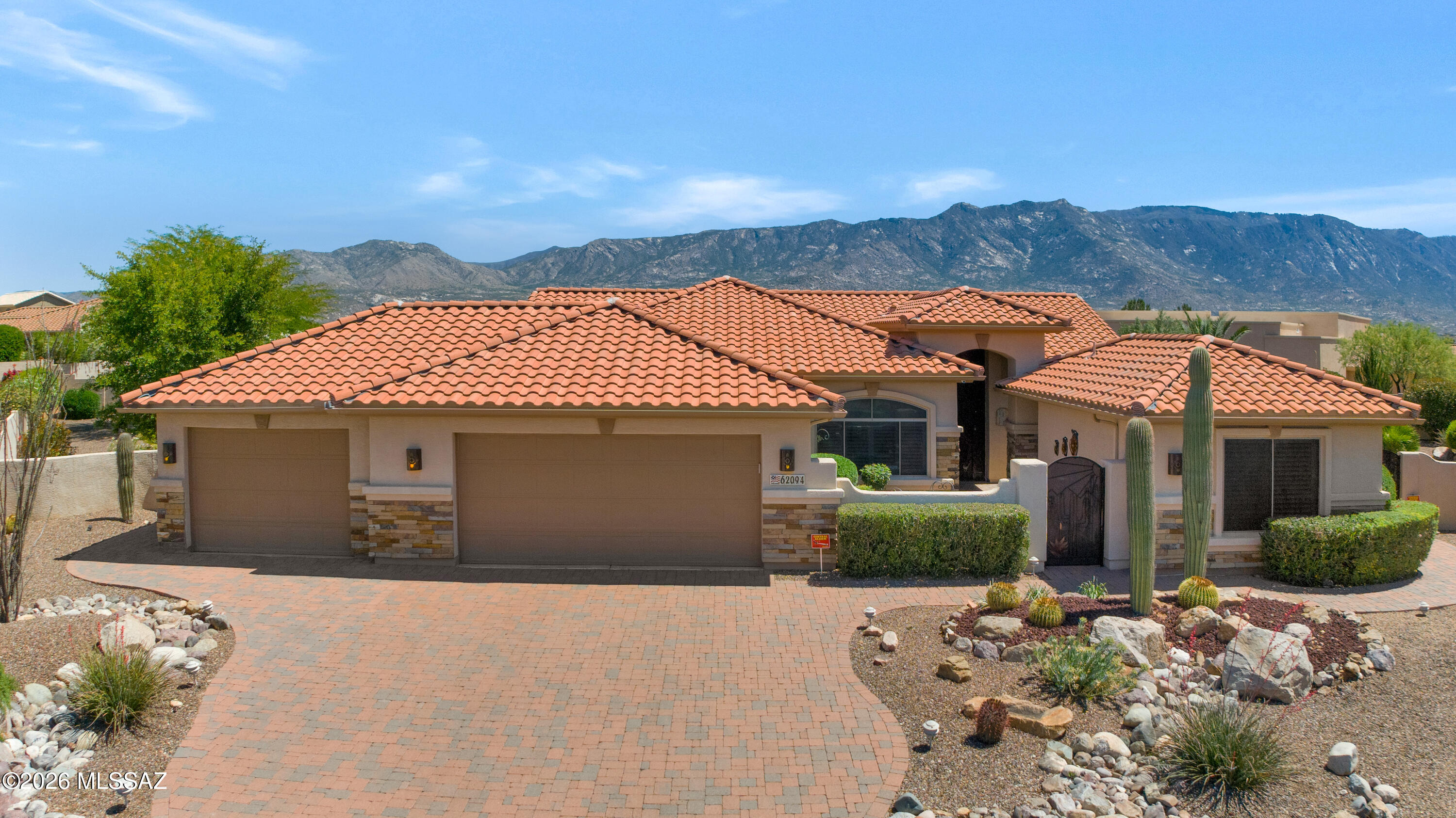 Stunning 3BD/3BA home with private casita situated on a large lot in SaddleBrooke featuring fabulous mountain views! This beautifully maintained property offers a desirable open layout with 42'' kitchen cabinetry, granite countertops, and a cozy gas fireplace perfect for cool desert evenings. Enjoy seamless indoor-outdoor living with auto patio screens, rolling screens on the front door and casita, and a spacious outdoor setting ideal for relaxing or entertaining.
Car enthusiasts and hobbyists will appreciate the extended 3-car garage with epoxy floor coating and paver driveway. Additional upgrades include an owned water softener, new water heater (2018), and new irrigation system (2025). A rare opportunity to enjoy privacy, views, and comfort in SaddleBrooke. Additional storage available in garage attics.  Security system includes security cameras.  Pull-out screens on front door and casita door.  Additional items to convey:  3 TV's-one in the great room, one in the master bedroom, and in the third garage space.