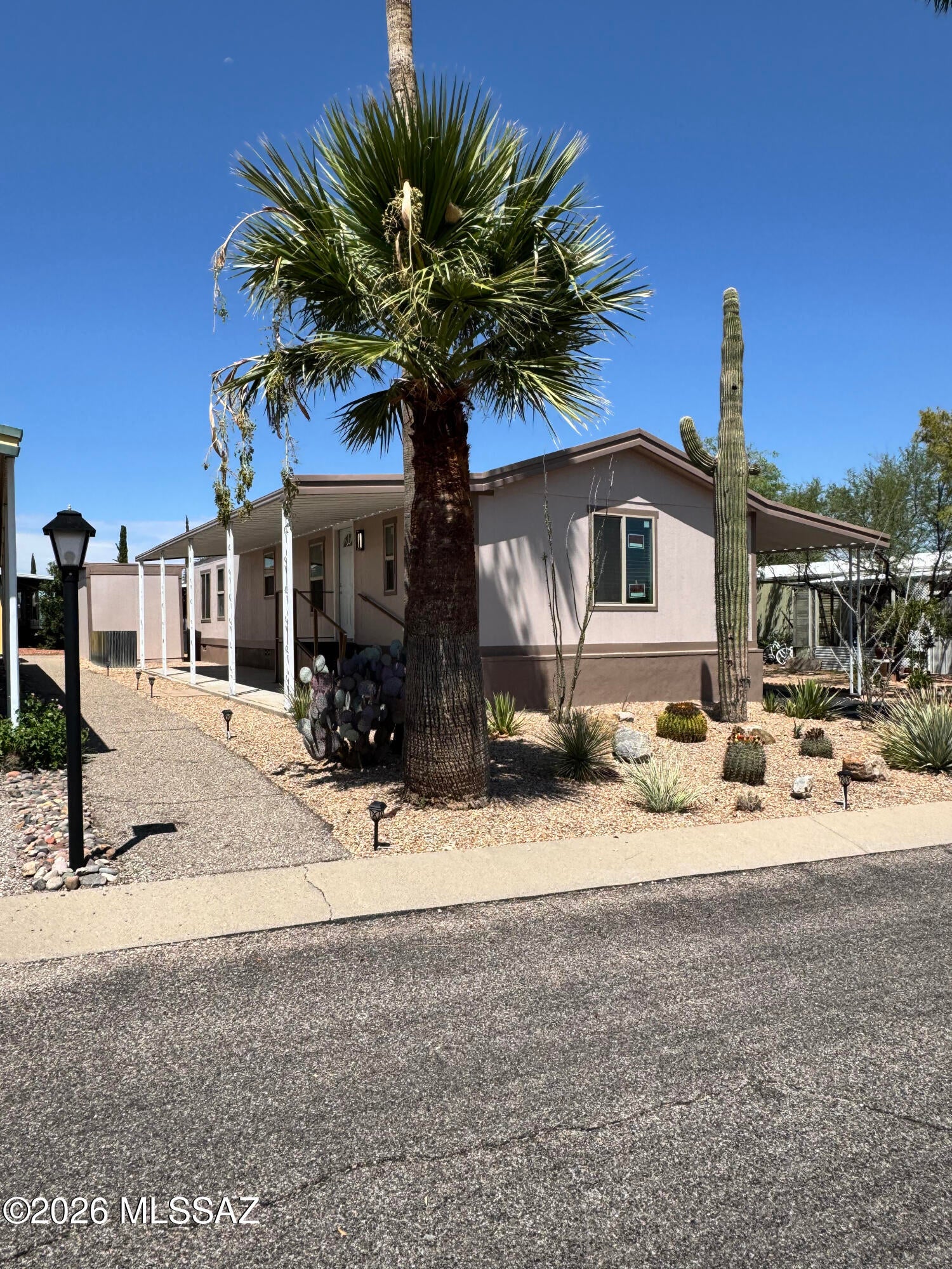 Beautiful FULLY remodeled 3-bedroom, 2-bath home in Harrison Hills! Tucked near the end of the street with open natural desert across the way and beautiful mountain views, this move-in-ready home has been thoughtfully updated inside and out. The bright kitchen features new cabinets, walnut butcher-block countertops, gas range, refrigerator and new appliances. Enjoy new flooring and carpet, fresh paint and drywall, new double-pane windows, modern lighting, updated bathrooms and a recently serviced 2021 HVAC system. Outside offers a fenced yard, covered parking, two storage sheds, plus ramp and stair access. Community amenities include multiple pools, heated pool, hot tub and clubhouse. Move-in ready and beautifully updated! All-age community.