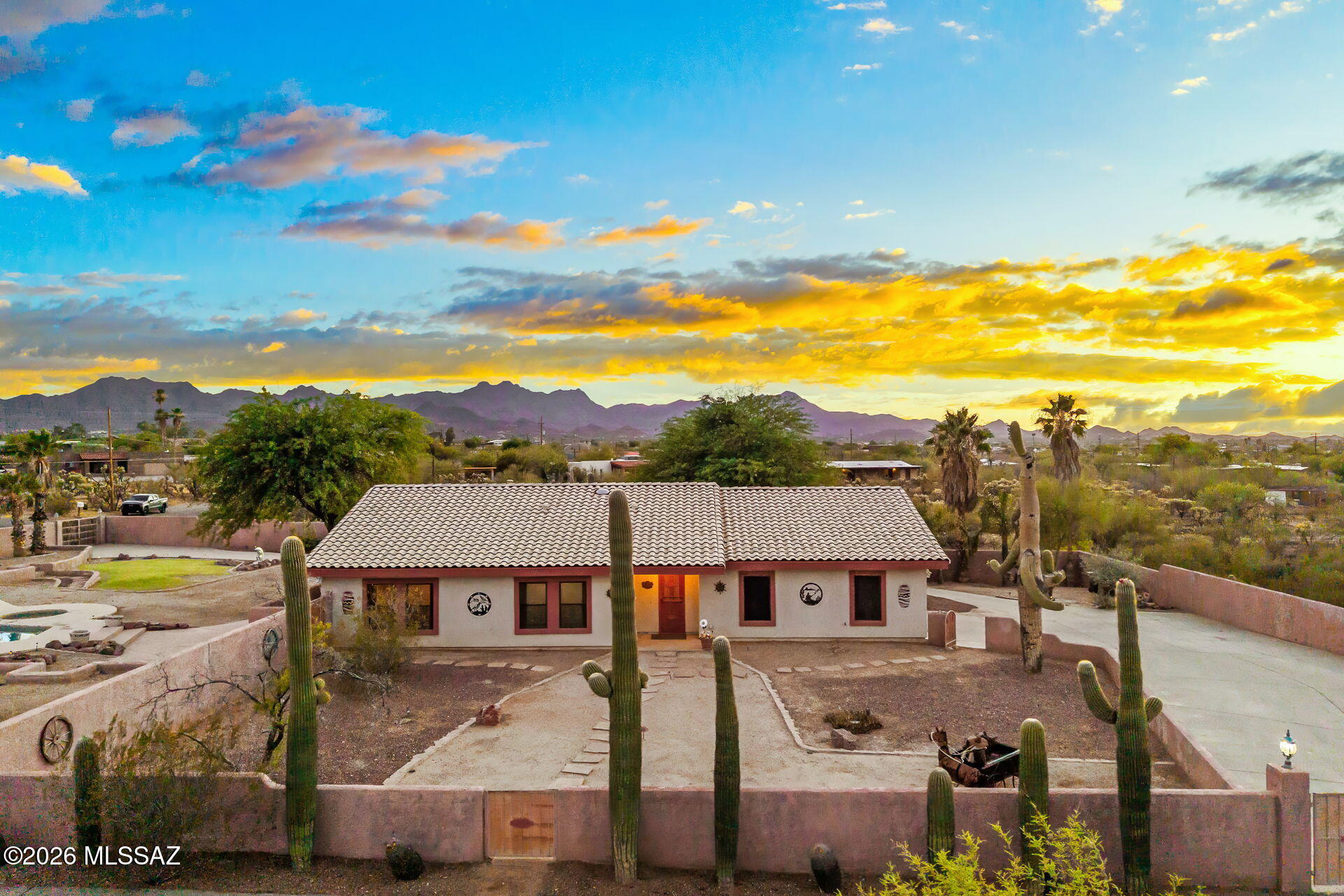Perched on a private full-acre homesite, this lovingly maintained Southwest retreat captures breathtaking panoramic mountain and desert views from nearly every angle. Surrounded by mature saguaros and open skies, the property offers the rare combination of privacy, space, and tranquility while remaining conveniently close to Tucson amenities. The well-cared-for home exudes warmth and pride of ownership, creating an inviting atmosphere both inside and out. Enjoy expansive outdoor living areas, a sparkling pool and spa, and endless room to relax, entertain, or simply take in Arizona's spectacular sunsets. Whether you're seeking a peaceful desert escape or a property with room to grow, this cherished home delivers the space, views, and lifestyle you've been searching for.