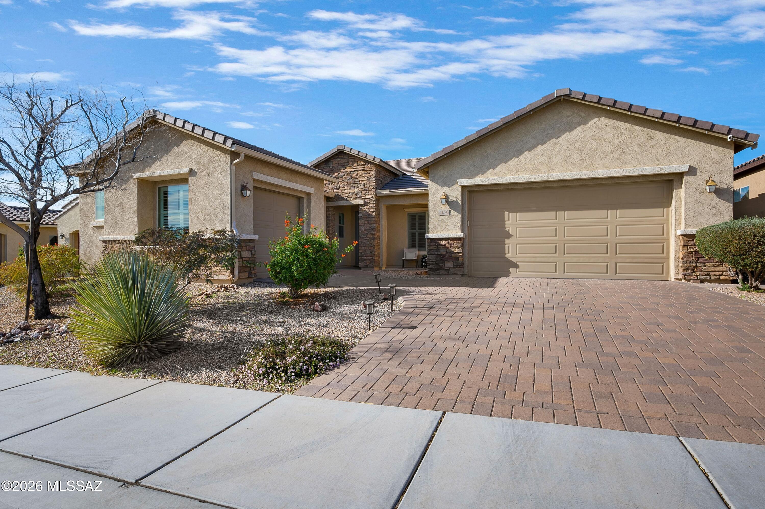 Experience refined comfort and effortless style in this beautifully appointed 3-bedroom, 2.5-bath residence located in the highly desirable, gated Tangerine Ridge community. Designed with modern living in mind, this home features a spacious open-concept floor plan complemented by thoughtful upgrades throughout. The welcoming great room is ideal for both everyday living and entertaining, showcasing soaring 10-foot ceilings, abundant natural light, warm engineered wood flooring throughout (no carpet), and custom wood shutters on every window. A versatile bonus room/den provides the perfect space for a home office, media room, or playroom to fit your lifestyle. At the heart of the home is the chef-inspired kitchen, complete with Samsung stainless steel appliances, a large center (continued)