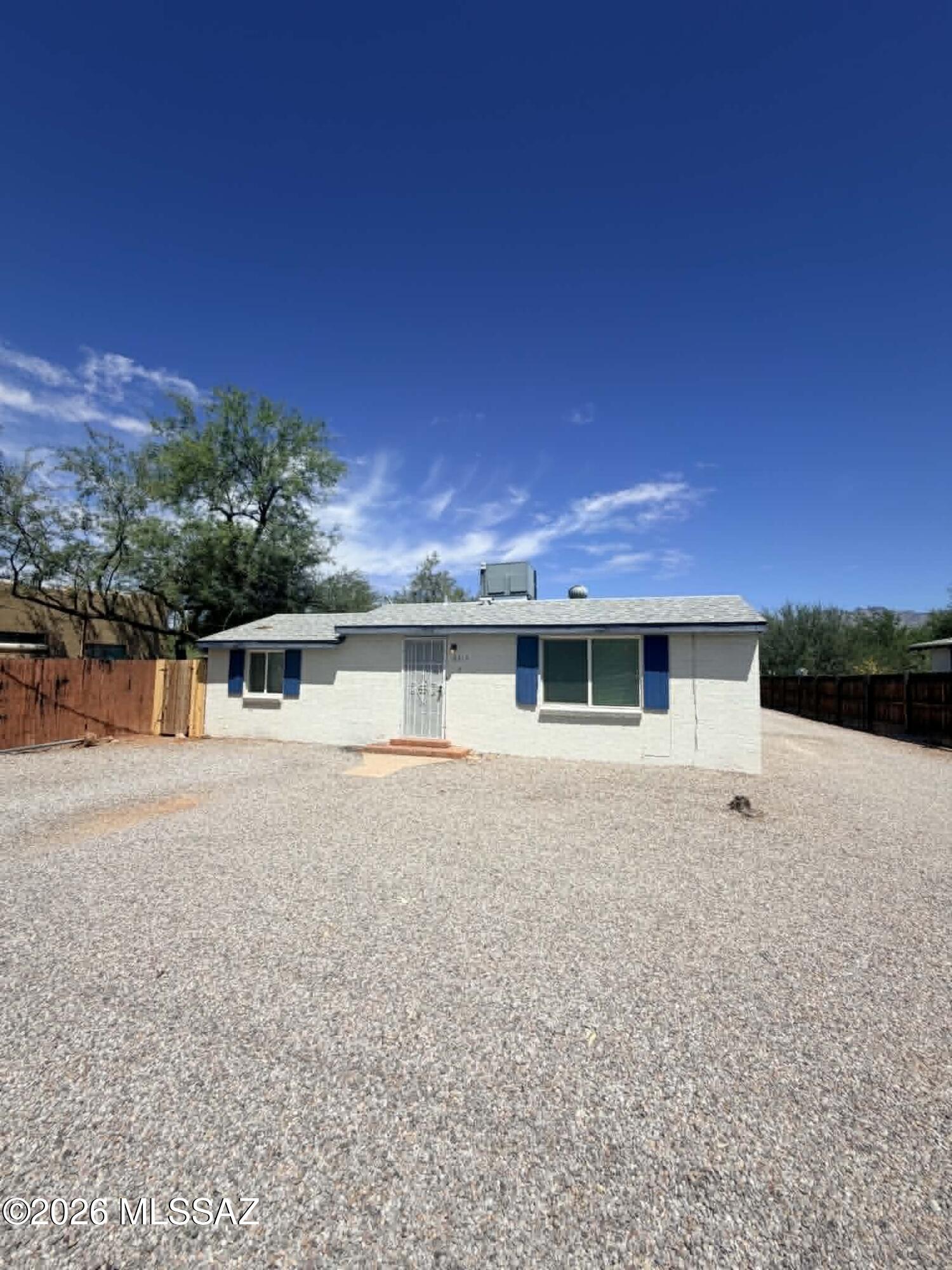 Charming 1BR/1BA single-family home in a convenient central Tucson location, offering a comfortable layout with a bonus area that's perfect for a home office, study, or additional flex space. This move-in ready home features attractive laminate wood flooring throughout with no carpet, making cleaning and maintenance a breeze. The kitchen includes a convenient island, refrigerator, stove, and plenty of cabinet space for everyday meal preparation. Stay comfortable year-round with A/C, heating, and an efficient layout. Outside, enjoy a small private backyard that is completely fenced with a brand-new fence, providing a great space to relax or enjoy time outdoors. A washer and dryer are included for added convenience. Pet friendly and close to shopping, dining, parks, schools. Near major roadways. Call today to schedule a showing!