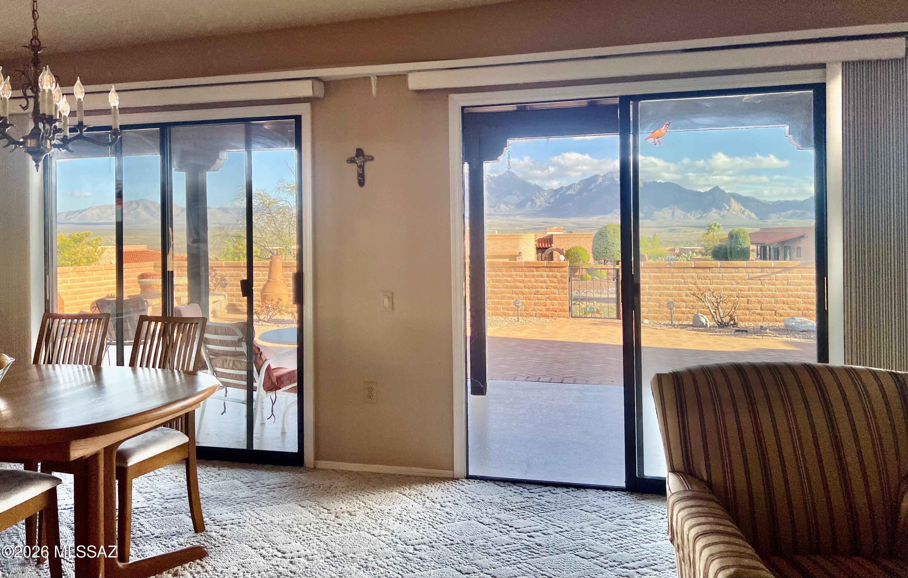 View of the mountain range from kitchen, dining,  living and primary room. Nice 2 bedroom, 2 bath with den. Remodeled kitchen with newer cabinets, appliances & flooring. Updated bath cabinets. Wonderful views from back of house and dining table.
Jetted tub and fireplace not working.
