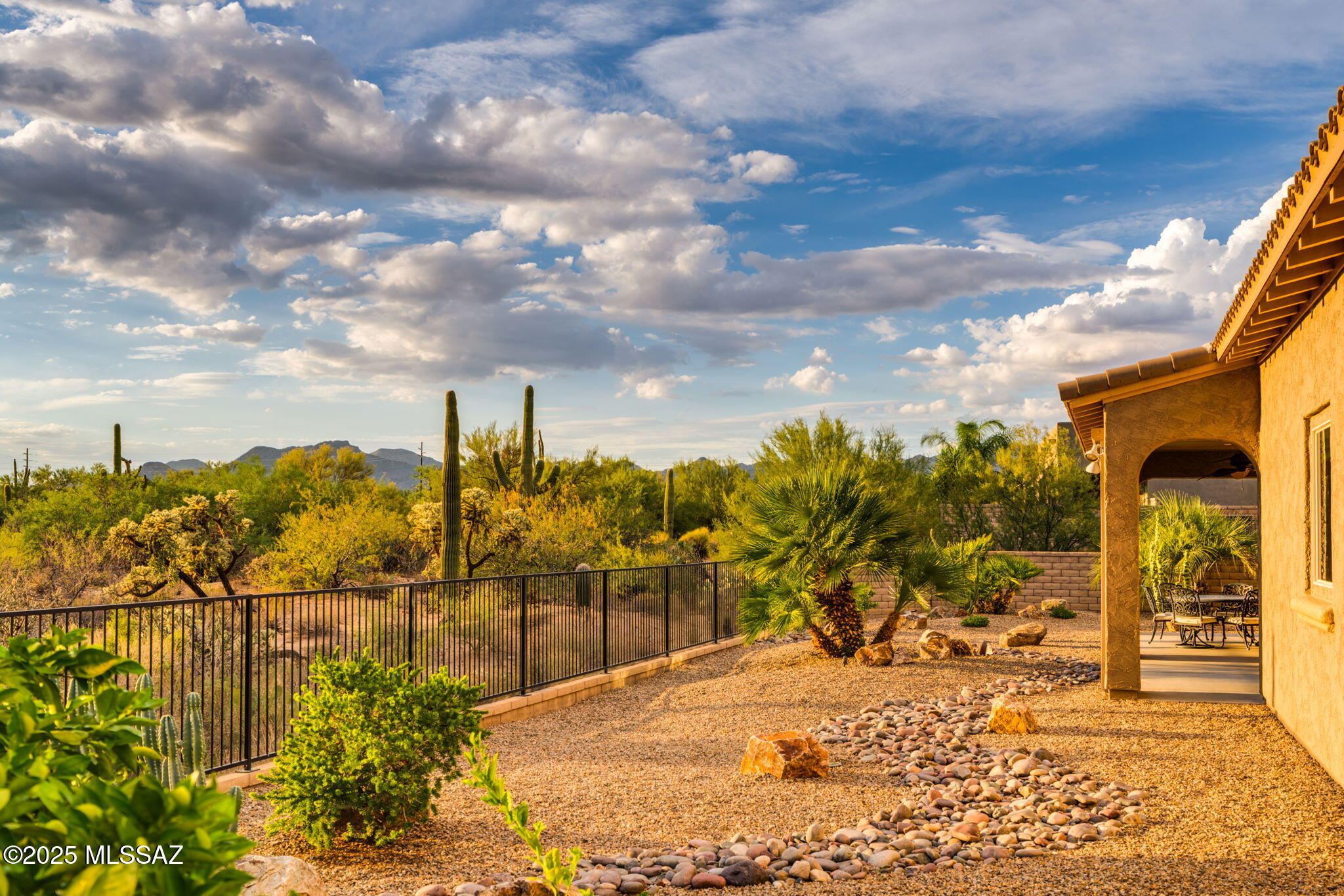 Discover your ideal retreat in this magnificent 2,990 sq ft home, nestled within the desirable gated community of Rancho Del Cobre, offering the best of Oro Valley living. Step through a custom iron front door & discover a meticulously maintained interior featuring 3 spacious bedrooms & 3.5 baths. Enjoy brand new carpeting in all bedrooms, providing a fresh & inviting atmosphere. Throughout the home, you'll find elegant 4-inch baseboards & stylish 2-inch wood blinds. The home also boasts a versatile den, perfect for a home office, library, or hobby room. The gourmet kitchen is a chef's delight, equipped with double ovens, SS appliances, custom backsplash, extended cabinetry all perfect for entertaining. Perched on a generous .488-acre lot, this property offers panoramic views of both spectacular sunrises & sunsets, painting the sky with vibrant hues daily. Immerse yourself in the tranquility of the natural desert landscape that surrounds your home. Car enthusiasts & those needing extra storage will appreciate the expansive 3-car garage. This highly desirable community provides security & a serene environment, making it the perfect place to call home.