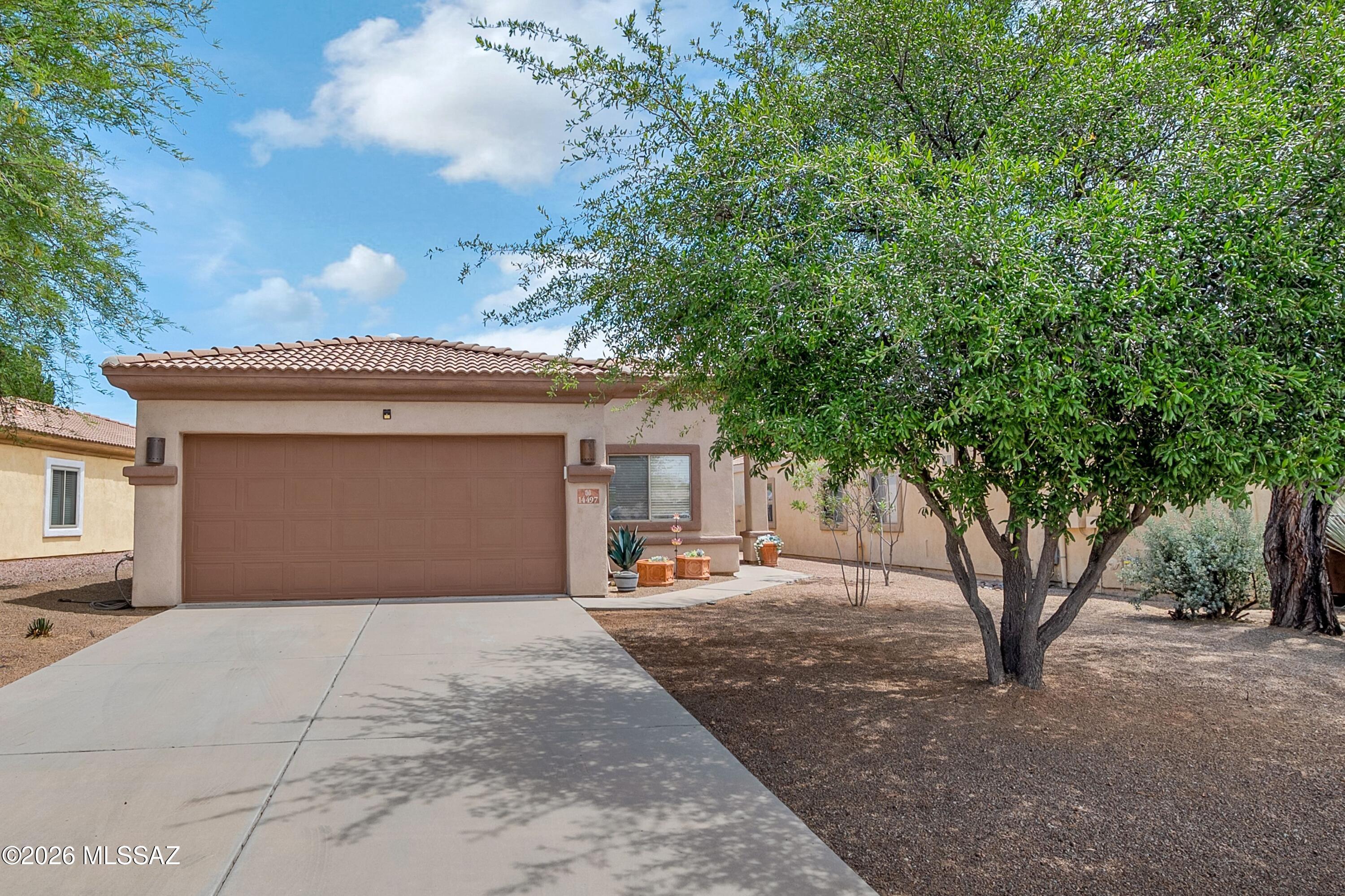 Beautiful 3-bedroom, 2-bath home in the highly desirable Rancho Sahuarita community, featuring updated flooring throughout, a modern kitchen with stainless steel appliances and granite countertops, and a backyard designed for low maintenance enjoyment with extended concrete paver patio and turf. This move-in ready home combines comfort, style, and convenience in one of the area's most sought after neighborhoods. Residents enjoy resort style amenities, including a clubhouse, fitness center, swimming pools, parks, a scenic lake, and miles of walking trails.
