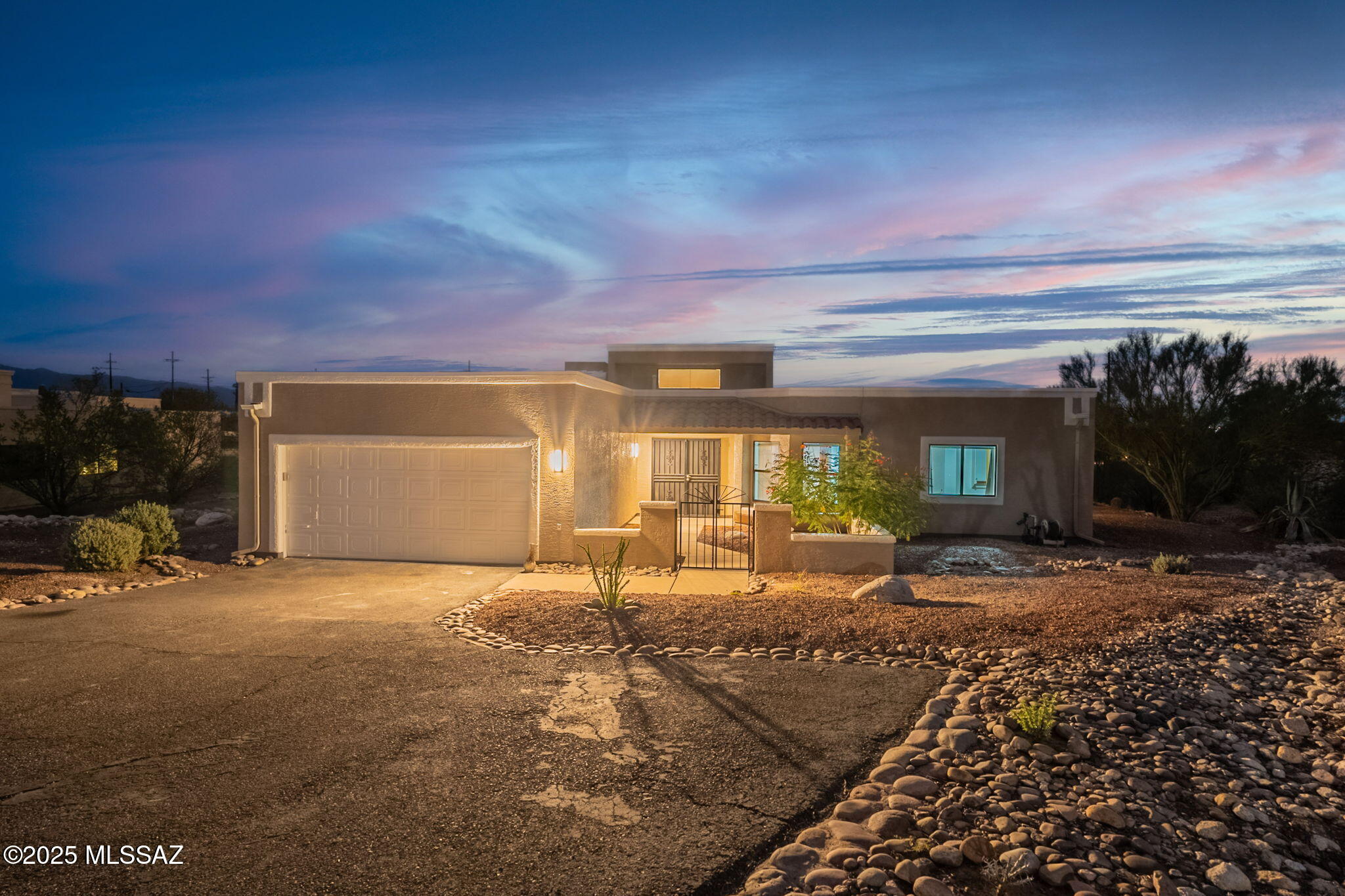 Welcome to this beautifully refreshed Foothills home in a prime Tucson location! Move-in ready and full of upgrades, this single-story gem sits on nearly 0.88 acres and blends charm, quality finishes, and comfort. Inside, enjoy fresh neutral paint, new bedroom ceiling fans, and a fully renovated kitchen with granite countertops, under-mount sink, upgraded faucet, and backsplash. The unique flagstone floors are cleaned, sealed, and gleaming. Spacious vaulted living areas offer great natural light, two full baths, and generous storage. Outside features fresh paint, mountain and city views, a covered patio, low-maintenance desert landscaping, and a 2-car garage. Tranquil yet close to shopping, dining, and main roads.