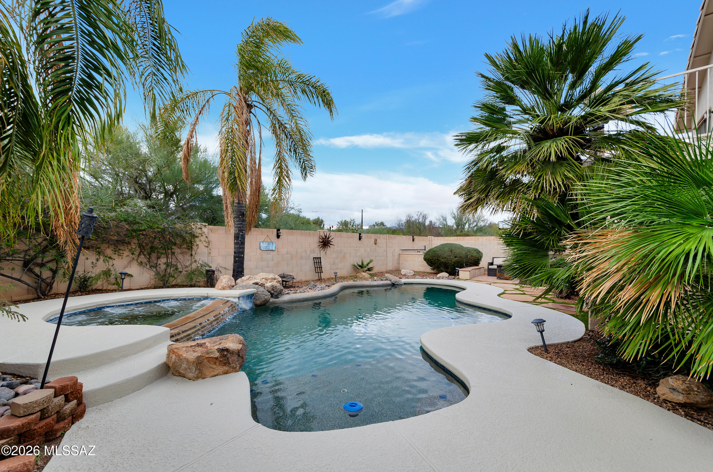 Welcome to Oro Valley, AZ, living as it was designed to be enjoyed. This home has been lovingly cared for & tastefully updated with new exterior facia paint, new carpet & fresh interior paint where needed. New tile grout. The gourmet kitchen with granite counters & stainless appliances is a chef's dream. This 4 bed, great room with gas fireplace home offers a desirable downstairs bonus office/yoga/study room. The 13th home fairway golf course & community center at El Conquistador Golf/Tennis is adjacent to this Catalina & Canada Hills neighborhood. The central location makes for easy living. Sparkling backyard Pool/Spa oasis awaits. Ironwood Ridge High School & Wilson K-8 School are just a few blocks away. Bike/Walking paths connect you to shopping, town hall, library and schools. HOME!