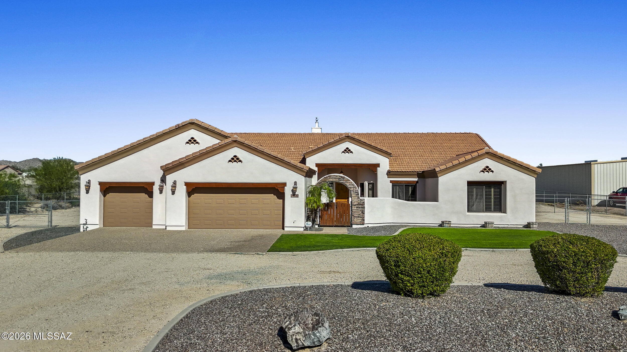 Meticulously maintained, this 3 bed, 2 bath single-level home offers 2,408 sq ft on 1.25 acres in Desert Views. The open great room features tile floors, a gas fireplace, and large windows overlooking a covered patio. The kitchen includes granite counters, knotty hickory cabinets, an island, dual ovens, gas cooktop, and water softener. Split-bedroom design with a private primary suite and spa-style bath. The insulated 40x50 shop offers dual 12x12 doors, floor drains, concrete access, 30/50-amp RV hookups, compressor hookups, 120-amp outlets, plus water and sewer stubbed. Ideal for RVs, hobbies, storage, or a home business. 3-car garage and laundry with gas/electric hookups. **POOL PLANS UPON BUYERS REQUEST** Enjoy a spa-style bath complete with a snail shower, soaking tub, dual vanities, and a generous walk-in closet.

The fully insulated, RV-ready 40x50 shop is a standout feature -- equipped with dual 12x12 doors, floor drains, concrete drive access, 30/50-amp RV hookups, compressor hookups, 120-amp outlets, and water and sewer stubbed for a future restroom. Whether you need space for RVs, hobbies, storage, or a home-based business, this property delivers.

Additional highlights include a 3-car garage and a laundry room with both gas and electric hookup options.

Space. Function. Freedom. This is the lifestyle Desert Views was designed for.