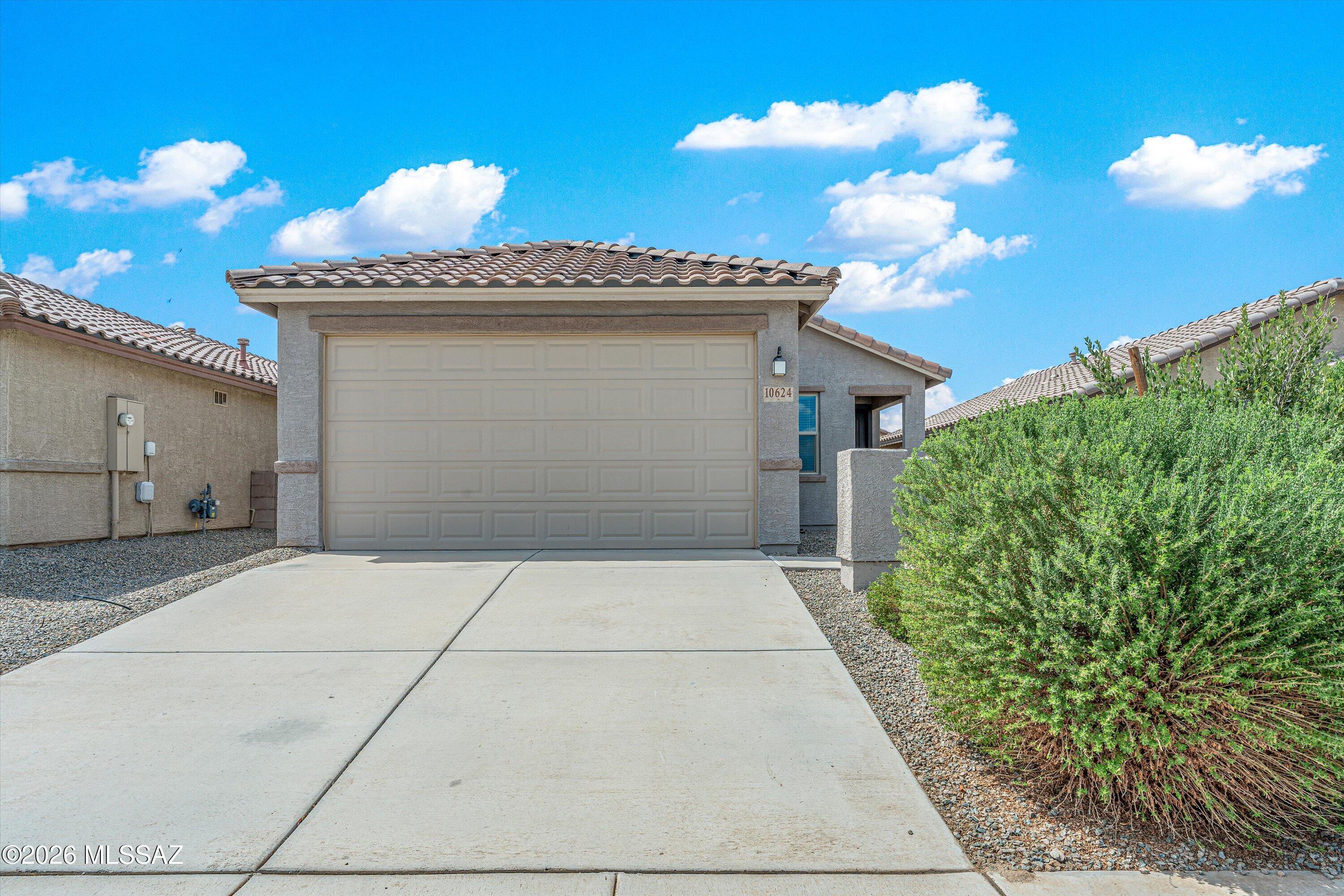 (Short sale. Subject to seller's lender approval.) Welcome to this well-maintained 3-bedroom, 2-bath home in the desirable Gladden Farms community of Marana. Built in 2022, this 1,465 sq. ft. home features an open layout, tile roof, stucco exterior, and plenty of natural light. The kitchen flows into the living and dining areas, creating a comfortable space for everyday living and entertaining. Situated on a 4,800 sq. ft. south-facing lot with low-maintenance outdoor space and convenient access to parks, trails, shopping, community amenities, and major roadways.