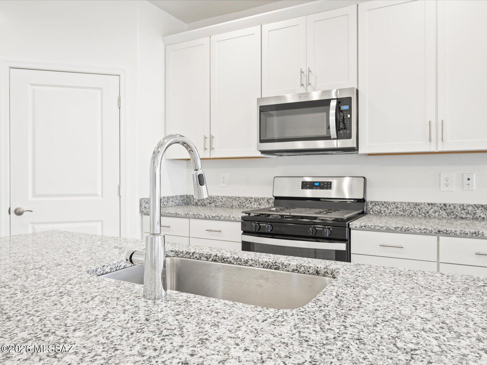 Brand-new, energy-efficient home available NOW! This spacious 4-bedroom, 3-bath home offers room for everyone, featuring a versatile teen room that's perfect for homework, movie nights, gaming, or a second living area. The private primary suite includes dual sinks and a generous walk-in closet for added comfort and convenience.

Located in Sunset Crest at Ajo & Kinney, residents can enjoy a peaceful desert lifestyle with community amenities including a neighborhood playground, picnic areas, and shaded ramadas designed for gathering and relaxation. Built with innovative, energy-efficient features, this home is designed to deliver comfort, savings, better health, and peace of mind for years to come.