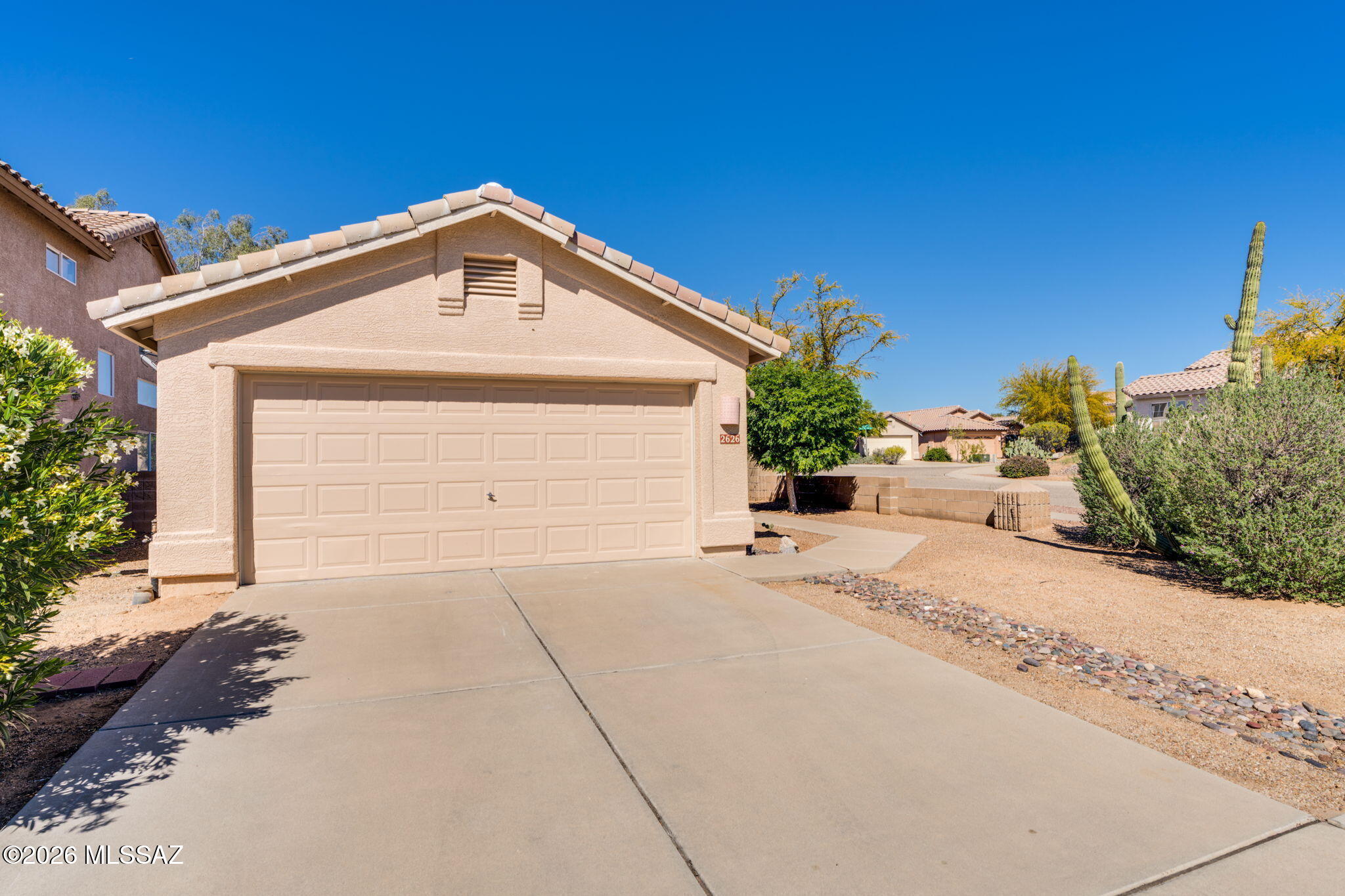Located in the desirable Bluffs II community in Northwest Tucson, this 3-bedroom, 2-bathroom home offers 1,344 square feet of comfortable living space on a corner lot and features NEW ROOF UNDERLAYMENT installed in 2025 for added peace of mind. The kitchen is appointed with Dolomite Quartz countertops and brand-new Whirlpool stainless steel appliances, combining modern style with everyday functionality. Fresh interior paint and updated fixtures, faucets, and ceiling fans give the home a clean, refreshing feel throughout. Ceramic tile flooring runs through the kitchen, great room, and bathrooms, while the bedrooms feature new luxury vinyl plank flooring for added comfort and durability. Continued... The spacious great room features vaulted ceilings, creating an open and inviting atmosphere that flows seamlessly into the kitchen and dining areas. Designed with a desirable split bedroom floorplan, the home provides added privacy between the primary suite and secondary bedrooms. A washer and dryer convey with the home, adding everyday convenience. 

Outside, the covered patio offers a great space for relaxing or entertaining. The corner lot provides additional space and flexibility, and the overall updates make this home move-in ready in a sought-after Northwest Tucson location.
