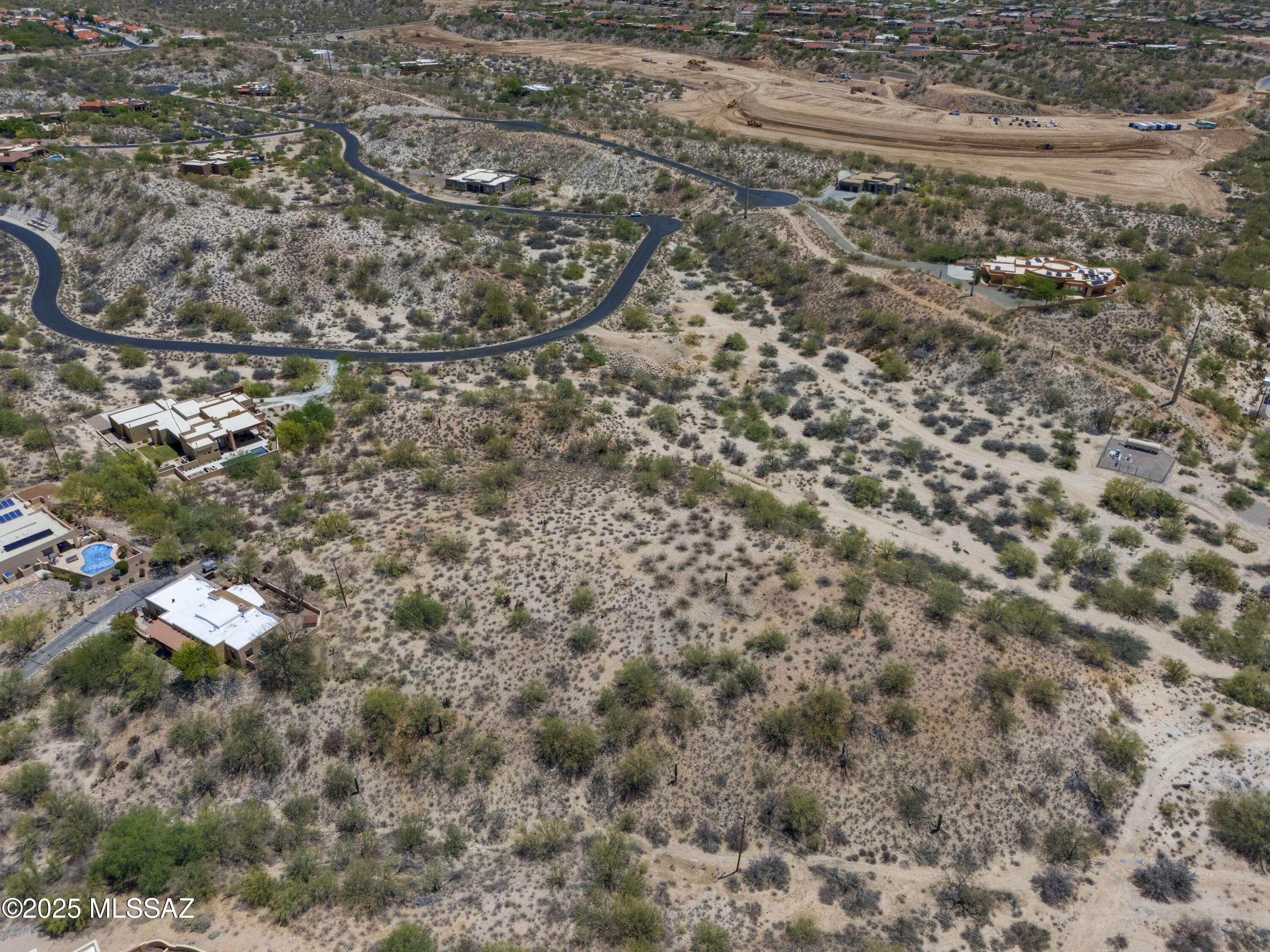 Private 3.3 + acre residential lot tucked away in a secluded gated community.   Incredible 180 degree Pusch Ridge and city views.  Close to shopping ammenities. restaurants and minutes to downtown Tucson.  Agent related to seller.
