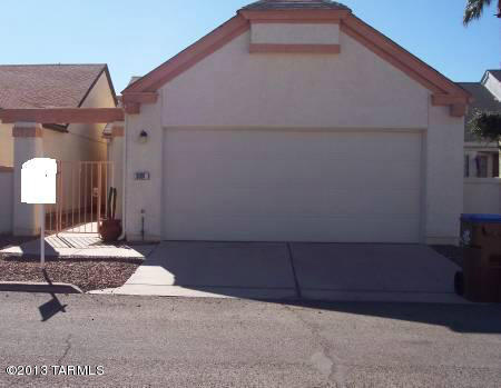 Nicely updated 2 bedroom 2 bath home with bright open floorplan, fireplace in the greatroom is decorative only, breakfast bar.  Tile floors in the living areas and baths, carpet in the bedrooms.  Washer / Dryer included, A/C, 2 car garage, storage, community pool.  Cortaro / Shannon