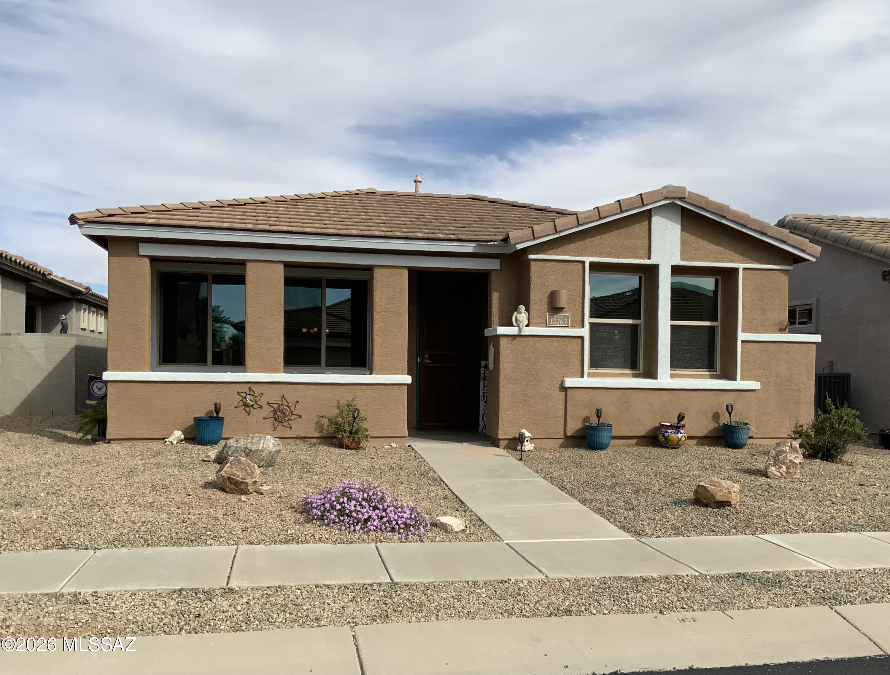Charming home w/fully owned Solar in Del Webb at Rancho del Lago - an established active adult (55+) community located in the heart of Vail, AZ. Inviting front porch, Living Rm, 2 Bedrooms + Den, 2 full baths, tall ceilings and tiled floors. Extended kitchen cabinets, granite counters, refrigerator, gas range, newer MW & DW, XL deep sink, rollouts. Tankless H/W. Laundry Rm, washer & dryer. Courtyard patio off kitchen with 2 gates. Garage has overhead storage. Rear garage entry from White Surrey Dr. 

Enjoy community amentiies and activities including: Swimming, spa, fitness, pickleball, tennis, bocce, classes, walking paths, and more! Del Webb is adjacent to Del Lago golf, close to grocery & conveniences. You can't miss the nearby Rincon Mountains...they always put on a show!