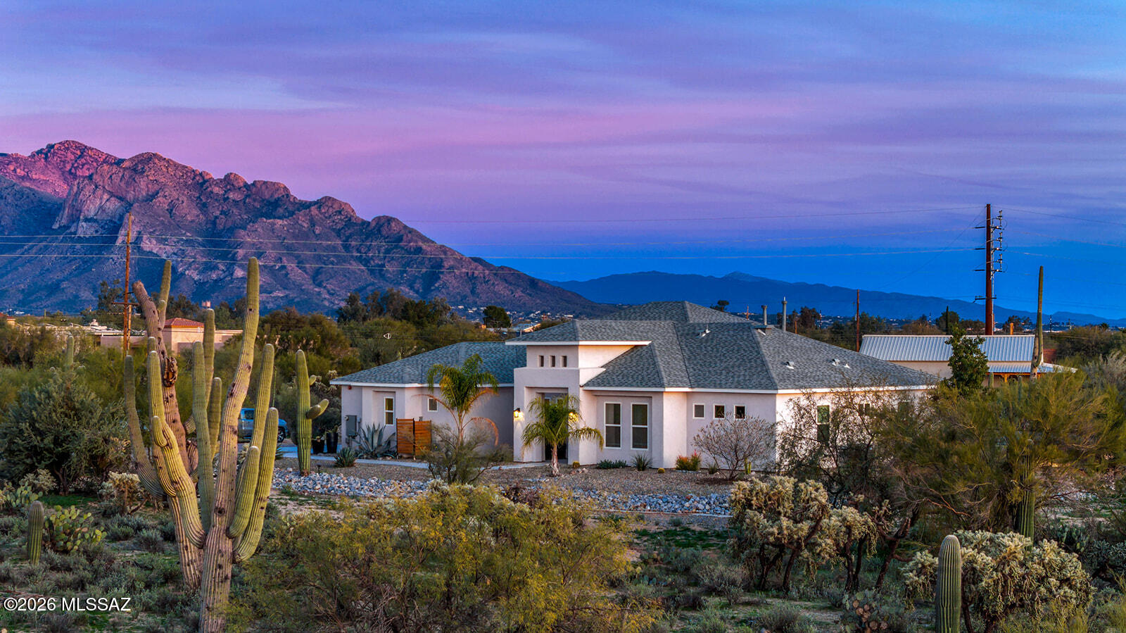 Built in 2019, this contemporary custom home features 4 bedrooms and 3 bathrooms, situated on 3.31 acres. Enjoy an open floor plan with large windows that showcase beautiful mountain views. The kitchen is a chef's dream, featuring quartzite countertops, a gas cooktop, a reverse osmosis system (also connected to the refrigerator water and ice maker), a spacious kitchen island, and a large pantry. The family room boasts oversized windows with breathtaking mountain views. A separate den, currently used as a theatre room, can easily be converted into the perfect in-home office. The primary bedroom includes a dream closet with abundant storage and direct access to the backyard. En-suite bathroom features double vanities, a separate shower and a luxurious jetted soaking tub. The house features both a double-car garage and a single-car garage. The double garage is the perfect man cave, complete with a mini-split HVAC system, epoxy flooring, and a mounted TV.

The backyard features artificial turf and wood/galvanized steel fencing, along with a gas hookup for a fire pitperfect for enjoying cool evenings and taking in stunning sunsets with unobstructed mountain views.

Plenty of land for ADU or worshop.

All blue ceramic pots in backyard remain with property, as well as three pots on the corner of front walkway.