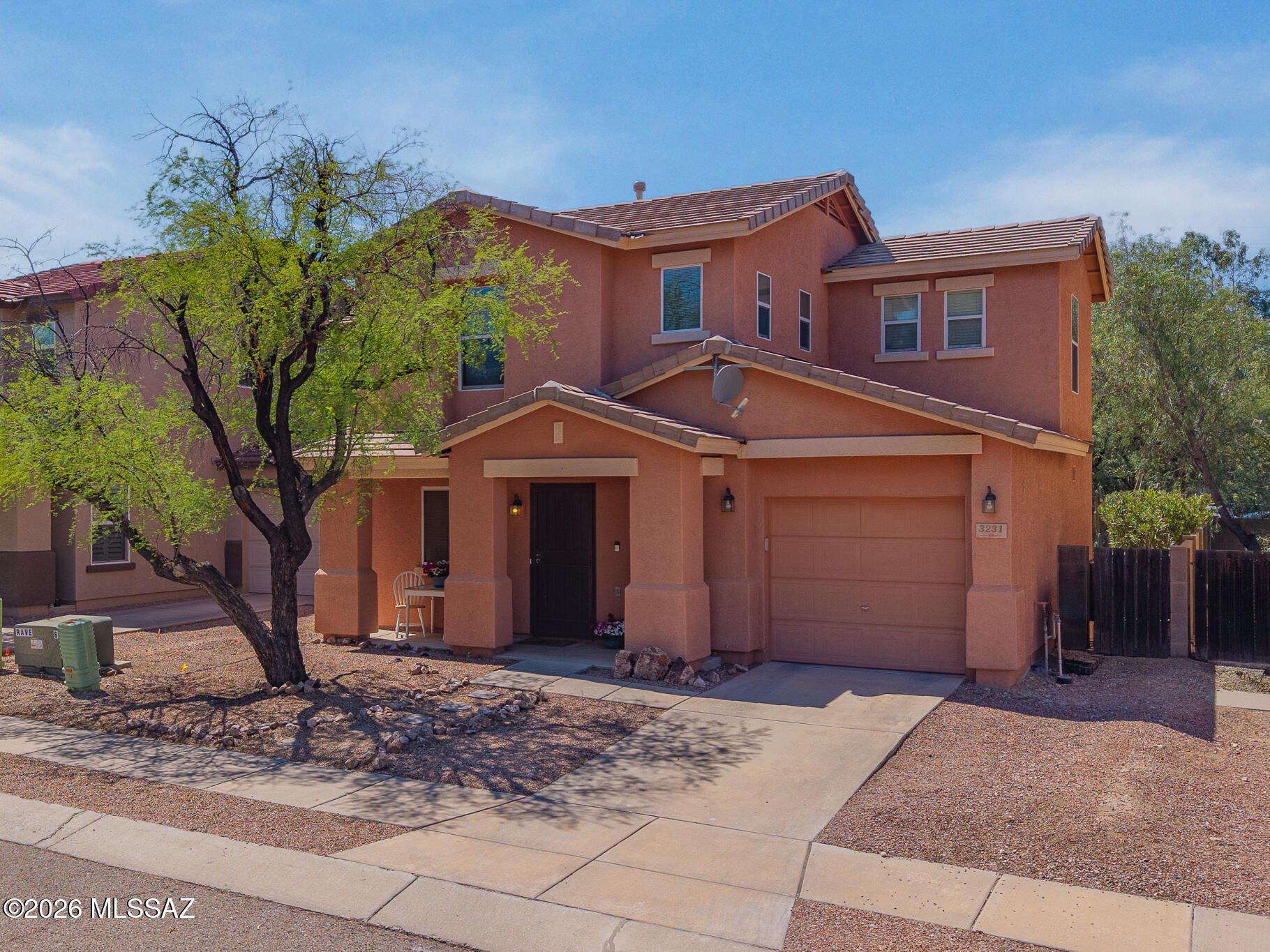 Sweet, stylish and wonderfully convenient!  This adorable 3-bed ,2 bath home offers an easygoing Tucson lifestyle with thoughtful updates already in place.  Newer ceramic tile flows throughout the first floor, while a 2-year-old HVAC system and 3-year-old water heater are two big ticket items already taken care of.  All appliances convey-including the washer and dryer -- making move-in-day that much easier.  Step outside to a spacious backyard with desert plantings, trees, and a fire pit, ready for morning coffee and evenings under the Tucson sky.  Sidewalks wind through this quiet community, and The Loop is nearby for walking, jogging, and cycling.  Best of all everyday conveniences are just minutes away -Dining, Coffee, grocery, medical care.  Comfortable, convenient and super cute!