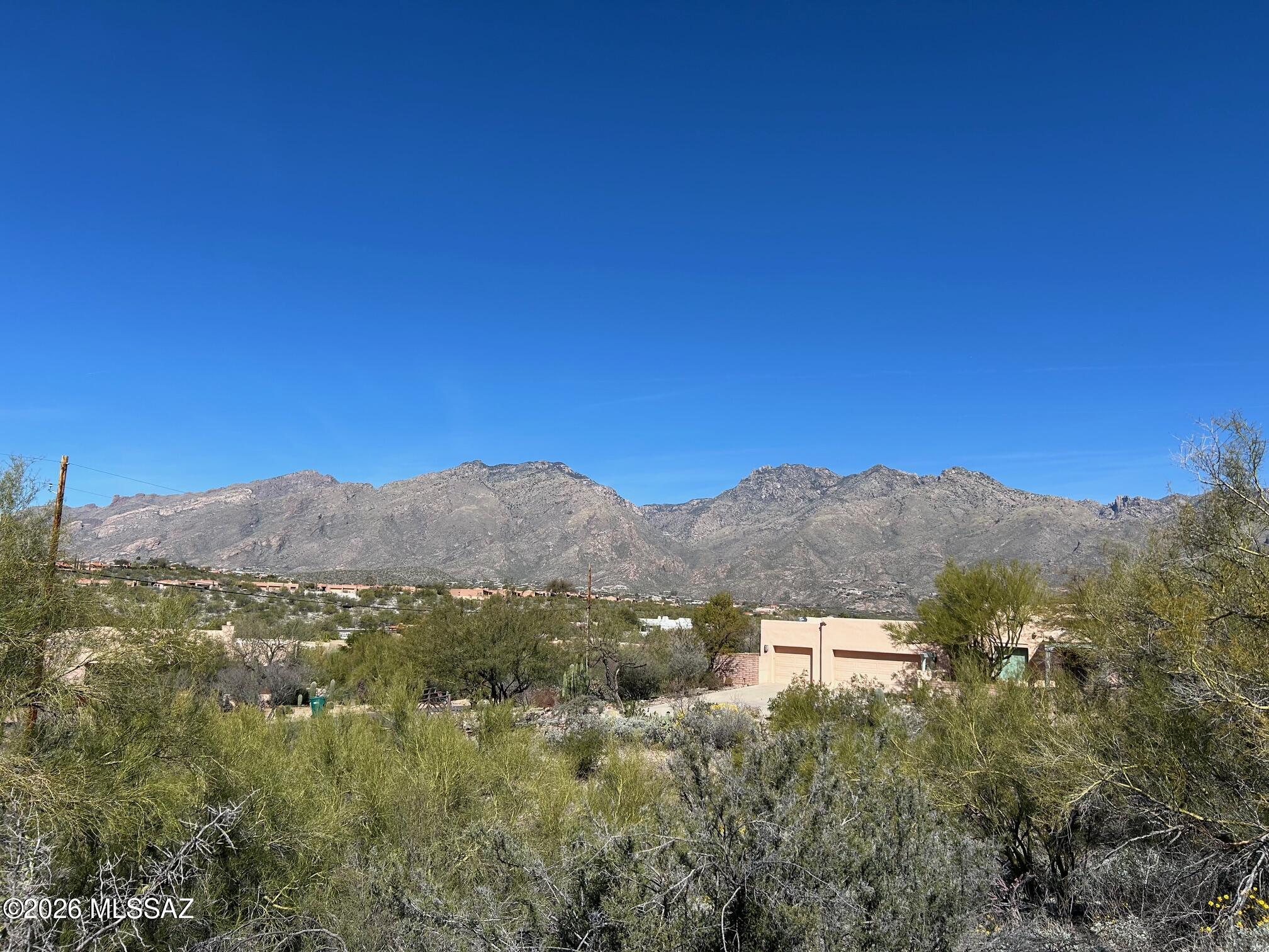 2.38 Ac., BIG VIEW FOOTHILLS LOT Under $200,000!  Great Location by Kolb/Sunrise for easy access to all FOOTHILLS shopping, services, restaurants, resorts and outdoor recreation.  Lot slopes up from the street: the higher you go the bigger the Catalina Mountain views along with City views to the south. Quiet and private street with all surrounding homes already built. All utilities in the street; septic recq'd. See the attached, owner's plan for 3291 sq. ft. single level home designed for the lot.  Must walk the lot to see the views. Follow pink flagging from the sign.