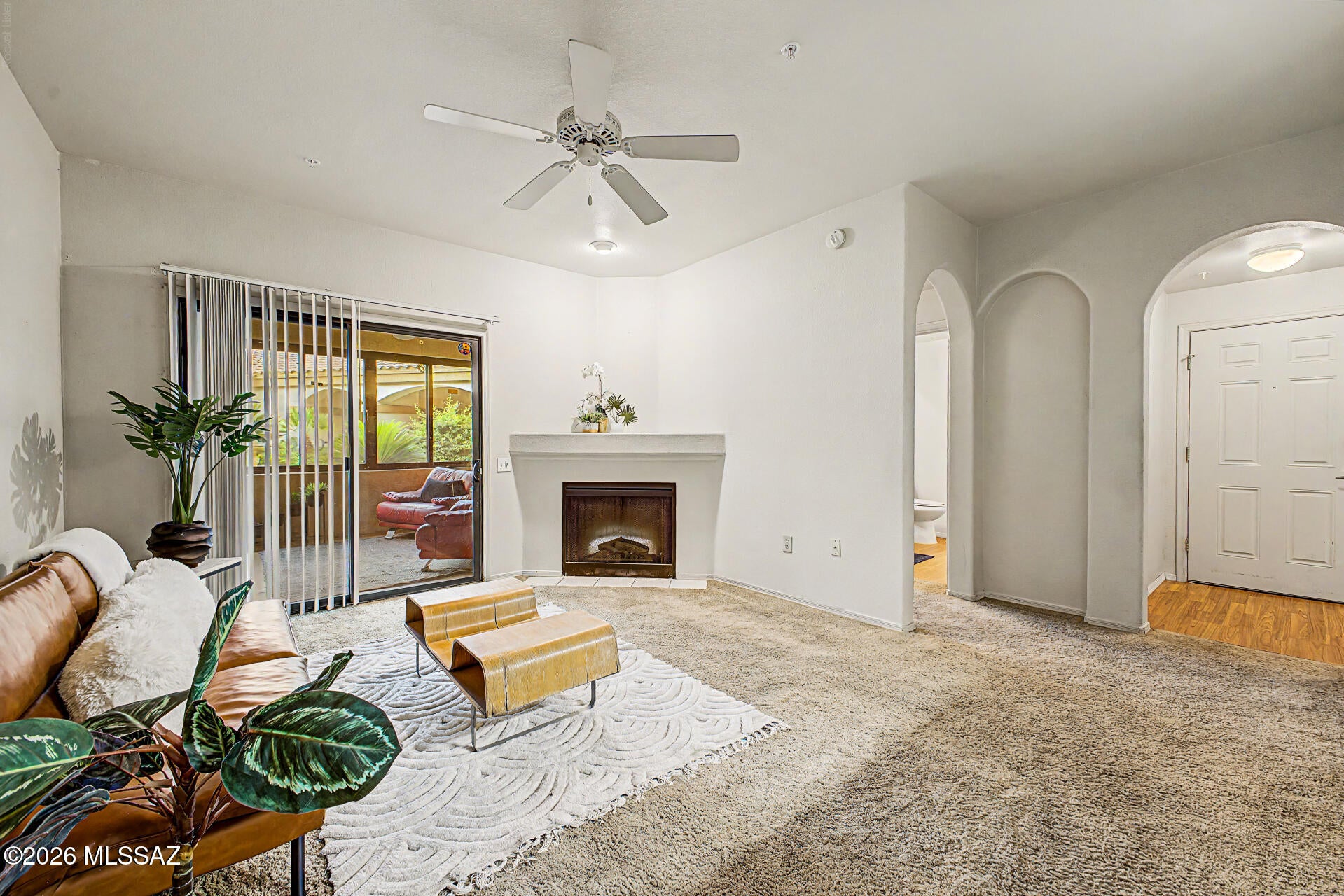 Seize the chance to own this charming 2-bedroom, 2-bath unit in the Villas at Hacienda Del Sol! This superb unit is closest to the visitor's parking area, mailboxes, community center, fitness center with bathrooms, and year-round heated pool & spa area. Discover a serene living room w/ a soothing palette, vertical blinds, soft carpeting, & an inviting fireplace for cozy evenings. The well-appointed kitchen comes w/ flat-panel wood cabinets, built-in appliances, a handy pantry, laundry area & a two-tier peninsula w/ a breakfast bar for casual meals. The cozy main bedroom includes sliding door access to Arizona room, private bathroom with recently-remodeled walk-in shower,, & a walk-in closet for an organized wardrobe. Spend quiet mornings, afternoons and evenings in the recently remodeled Arizona room, perfect for enjoying the warm Arizona weather year-round. Arizona Room has a separate storage area that includes hot water heater. The Community boasts 2 refreshing pools and spas. Also included is a covered parking spot for 1 vehicle. Association Fees includes: Water, Sewer & Waste Collection Containers.
