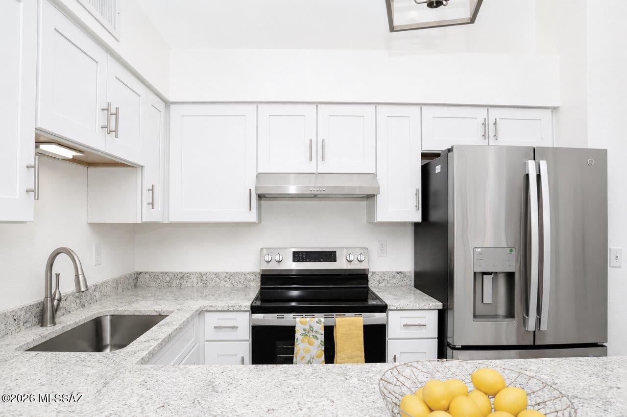 WELCOME to this completely remodeled townhome that is truly move-in ready! This beautifully updated home offers nearly 900 Sq/Ft of thoughtfully designed living space with modern finishes throughout. Recent renovations include a brand new roof, new flooring, new cabinetry, gorgeous granite countertops, and a full suite of brand new appliances, providing comfort, style and peace of mind. The bright open floor plan is complemented by a charming private yard - perfect for relaxing, gardening or enjoying your morning coffee. Conveniently located near shopping, restaurants, parks, schools and everyday amenities. Whether you are a first time home buyer, looking to downsize, or seeking a turnkey investment opportunity, this beautifully renovated townhome is ready to welcome you home.
