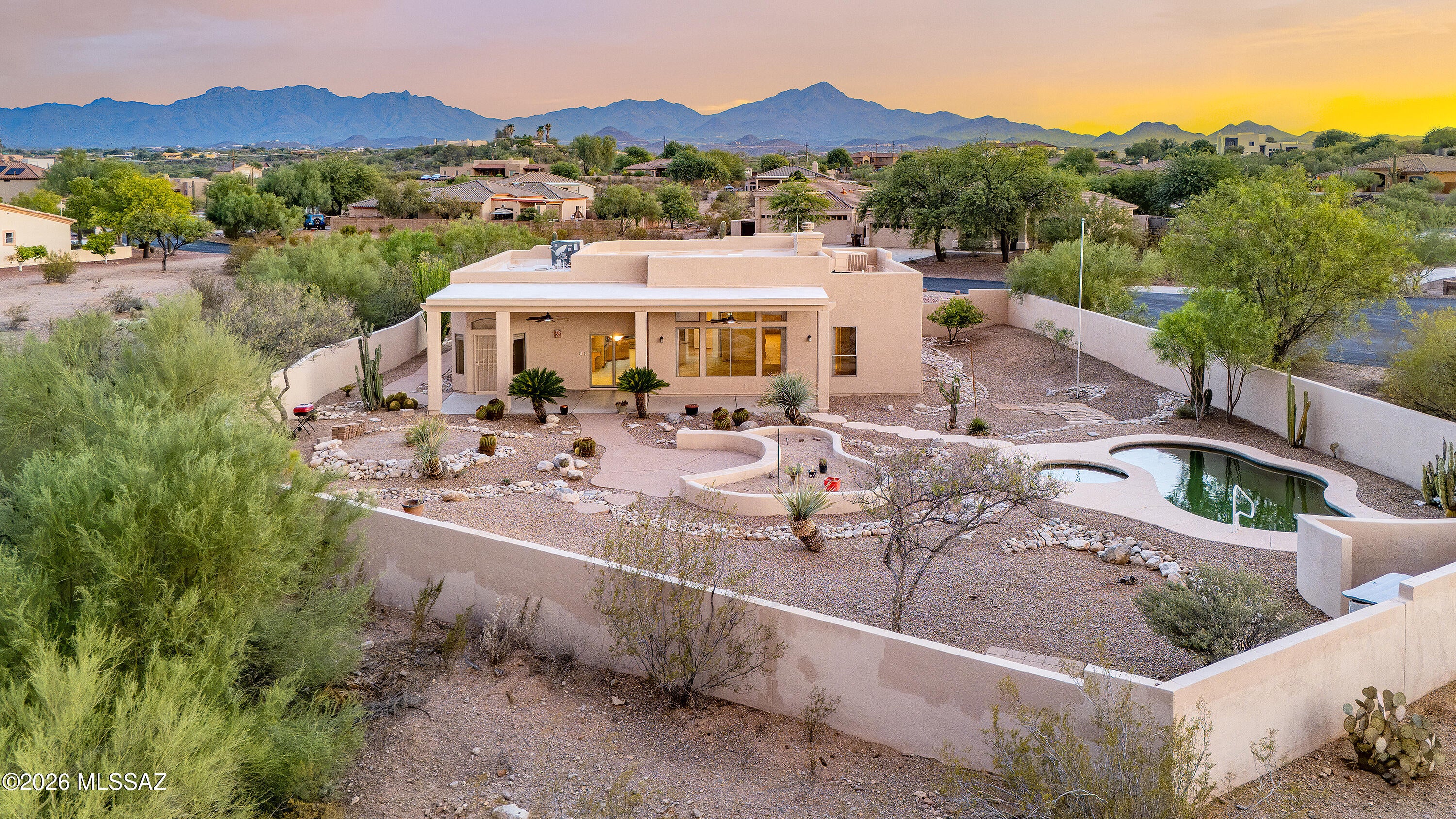 This classic Southwest style home is ready to move in! featuring a huge 1 acre plus lot with east facing back yard with views of the Catalina Mountains! Large open great room with a separate formal living room and separate formal dining room. Large gourmet kitchen with large island with granite slab counter tops of lots and lots of cabinetry with a walk-in pantry. This split bedroom floor plan is perfect for guests. The large primary suite has sliding glass doors to the covered patio, plus a large primary bathroom with large walk in closet. The home also features a 3 car attached garage with a private cul-de sac setting. The back yard is an incredible retreat with a below ground pebble tec pool and spa. Extensive updates recently done to this home, all new exterior and interior paint. New carpet and much more