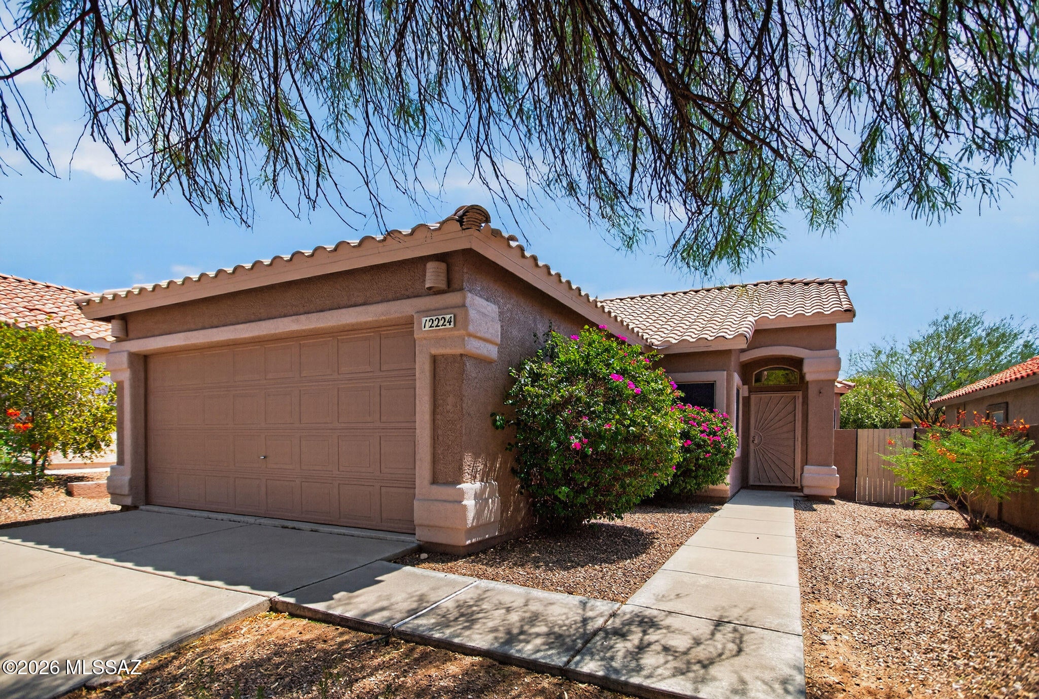 Beautiful home in a prime Oro Valley location close to shopping, restaurants, golf courses, hospitals, hiking and biking trails, and many other amenities. Fresh interior paint and attractive tile plank flooring make this home move-in ready.

The kitchen features updated cabinetry with stainless hardware, stainless steel appliances including a side-by-side refrigerator with water and ice dispenser, range, built-in microwave, and dishwasher. The dining area includes a bay window that provides plenty of natural light.

Additional features include window coverings, a spacious backyard with a block wall and side gate, a 2-car garage, and a concrete driveway with ample parking for guests.

A great opportunity to own a well-maintained home in one of Oro Valley's most desirable locations