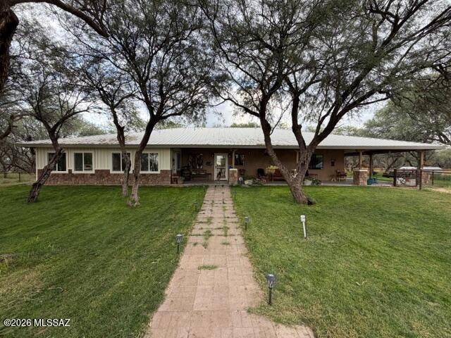 This one of a kind 6.6+/- acre property features a 2100SF 3BR/2BA ranch style home with a whap around porch, Arizona room, fenced yard, 3 car carport, grid tie solar, back up generator, equipment barn, 1 RV parking spot is remote and is completely surrounded by farms. Lot#2 58 +/- acres is also available for sale and features  a barndominuim, feedlot, 21 irrigated acres, hay barn, shop, tack room, working corrals, 4 stall horse barn, two ponds, with access to the San Pedro River is priced at $990,000. Call for a showing. Property is owned by a licensed real estate broker.
