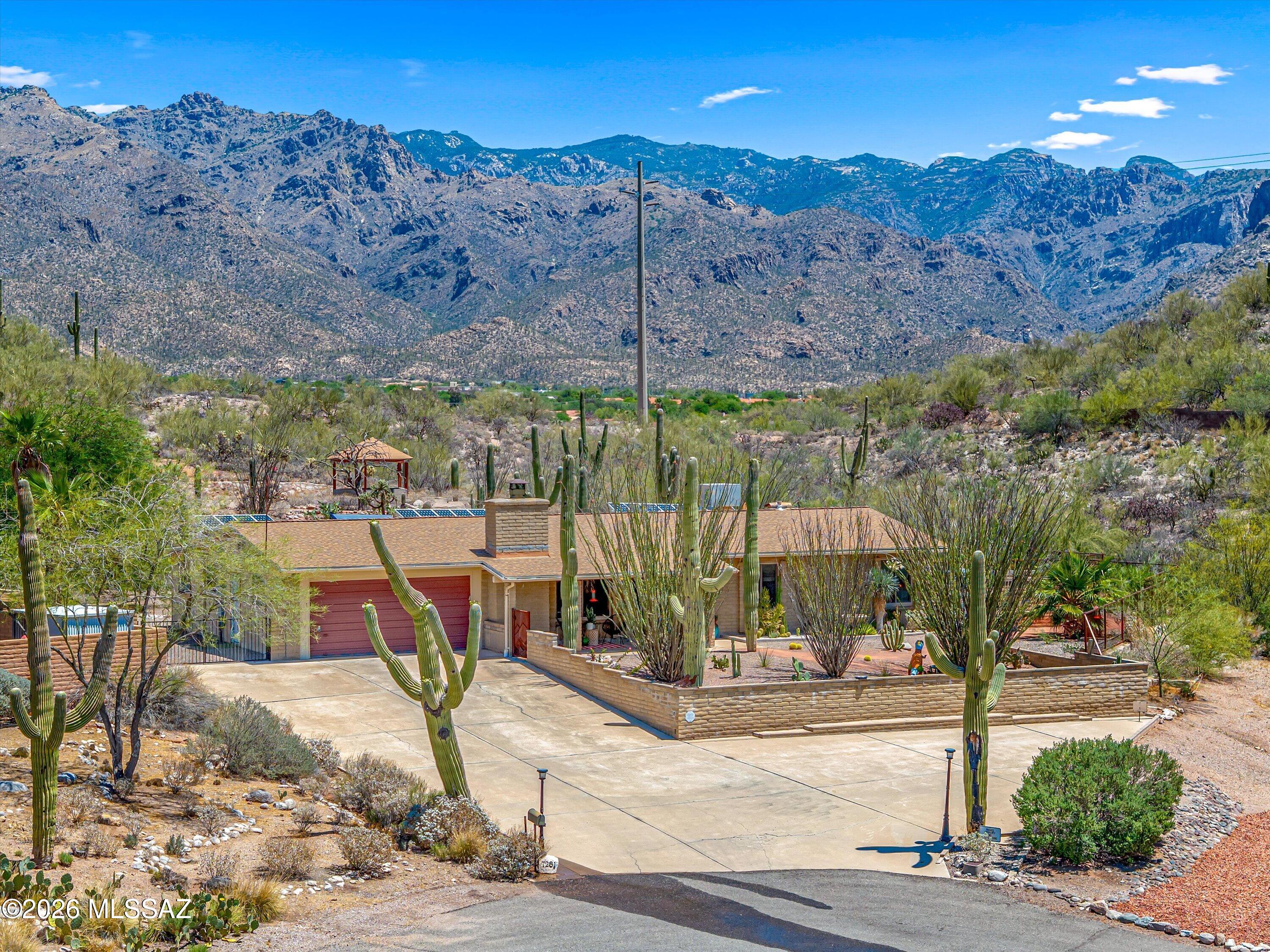 Welcome to your tranquil, Catalina Foothills oasis. As you enter the home on your elevated lot, you will be greeted by exquisite Southwest touches throughout. Take note of the recently updated kitchen with quartz countertops, updated backsplash and appliances, refreshed cabinets, along with the remodeled laundry room.

As you exit to your backyard, you will see what makes this property so special - A lot that is over 0.6 acres abutting onto nature and jaw dropping Santa Catalina mountain views. Your backyard offers mature desert landscaping, including majestic saguaros ocotillos and a dedicated green house. 

Take a walk up to your private gazebo for even more spectacular views. The home also has a rainwater catchment system which connects to the water irrigation system. The home's location at the end of a cul de sac provides an elevated level of peace and quiet to enjoy your outdoor space. 

RV parking is available, and the solar system is owned. Come see what makes this rare find so special, and make it yours.