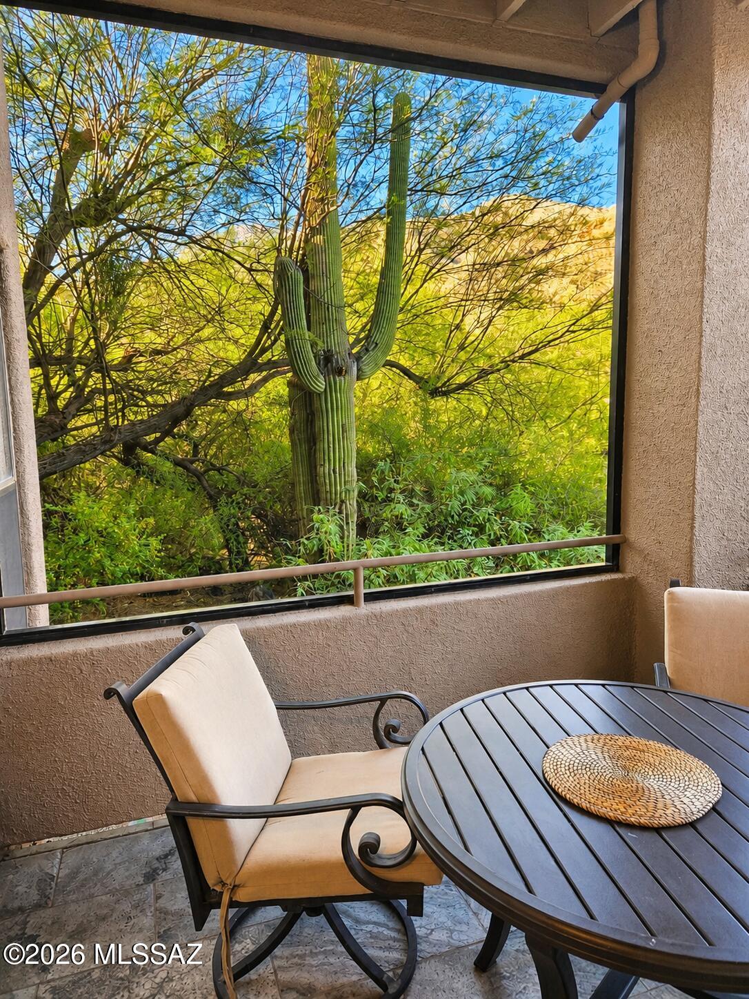 A beautifully refreshed, ground-level three-bedroom condo in the sought-after Canyon View community.  Take in the beautiful mountain silhouettes right from your living room and screened patio.  The primary suite offers a generous walk-in closet and its own patio access, giving it a quiet, private feel. Step outside the front door and you're moments from the Ventana Canyon trail system, with Sabino Canyon just down the road.  Canyon View residents enjoy a long list of perks: two heated pools, relaxing spas, a tennis court, a well-equipped fitness center, business facilities, two clubhouses, grilling areas, and direct access to some of Tucson's most iconic hiking terrain.