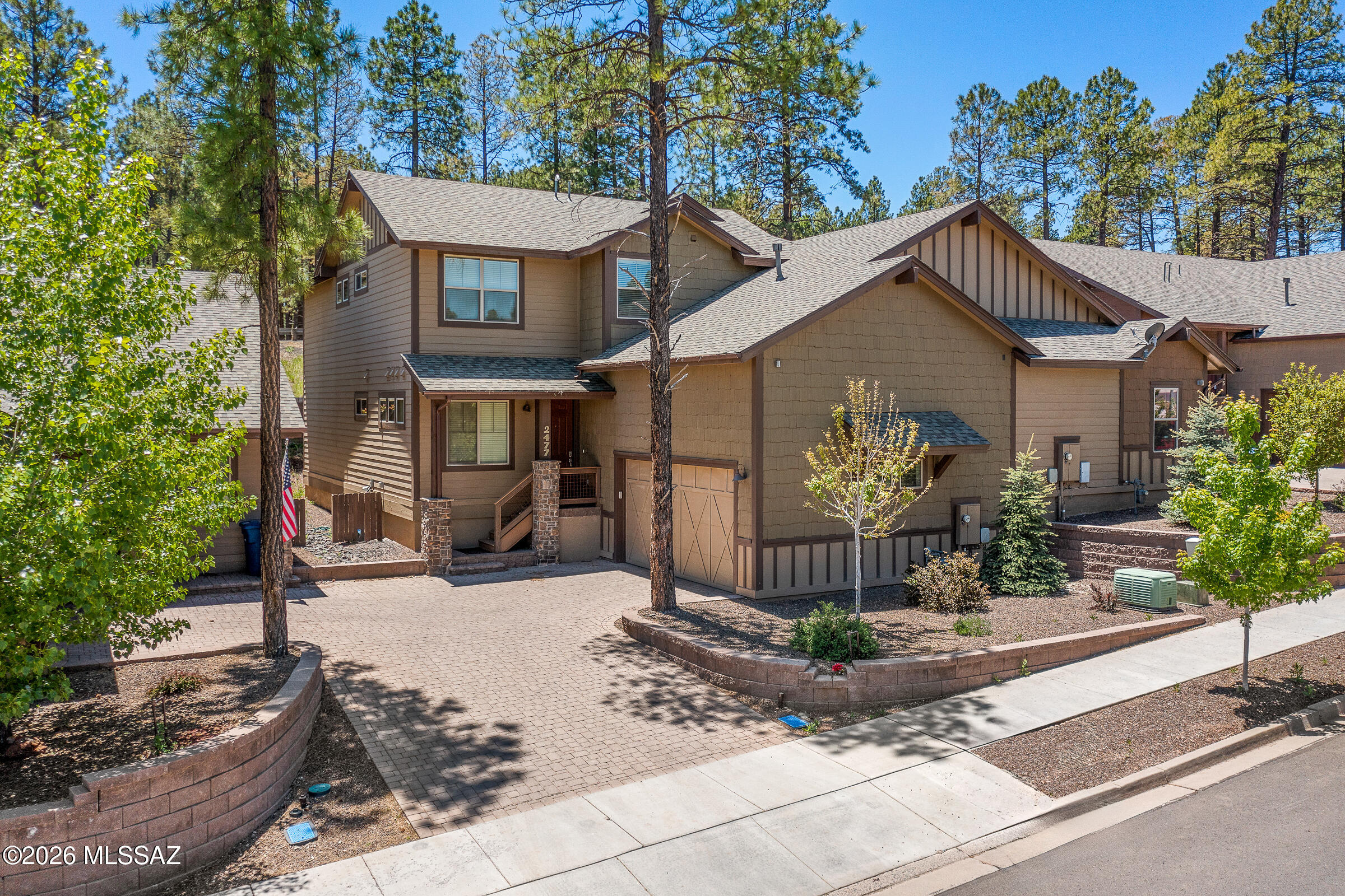 Your luxurious retreat in the pines has arrived and may come FULLY FURNISHED with the right offer! THE perfect home for Northern AZ mountain living! Centrally located in West Flagstaff, close by downtown yet quietly tucked away in the highly sought after community of Presidio In The Pines. You will be blown away by a soaring 20' Cathedral ceilings! This well appointed townhome features 4 spacious bedrooms & 4 full bathrooms plus an expansive loft & A/C to keep you cool during summer! One of TWO primaries w/en-suite bathroom is located on the main level along w/another bedroom & full bath for your guests. With a desirable floor plan, the impressive kitchen is open to dining area & great room. Enjoy cozying up by the gas fireplace & marveling at the views while BBQing on your back patio! The kitchen is complete w/granite countertops, breakfast bar top seating, pantry, gas stove, matching black GE appliances, & stainless steel Frigidaire refrigerator. Also featuring 36'' cabinets with Georgetown Cherry finish in kitchen, w/matching cabinetry in the laundry room along w/GE washer & dryer. All appliances are included!

Upstairs you will find a huge loft plus two additional bedrooms & bathrooms. One of the bedrooms is the second primary w/en suite bathroom. The primary suite on the main floor & secondary bathroom upstairs both include dual sinks. Both primary bedrooms feature expansive walk-in closets. There are an additional 5 closets outside of the bedrooms for all of your storage needs!

This home is ENERGY STAR CERTIFIED! It includes ERV - clean air exchange system. Floor coverings include engineered wood, ceramic tile, & carpeting in the loft & bedrooms. Finishing touches include brush nickel bath accessories & electrical fixtures. 9' ceilings & 8' doors throughout, dual pane low E windows & glass door, key less 2-car garage, & a gas drop for the BBQ on your covered patio are additional features you will find in this magnificent home. With a low-maintenance design, this lock-and-leave retreat is a perfect blend of modern elegance & effortless living.

APPRAISED for 732K in March 2024! Utilized as a thriving Air BnB property for about 1.5 years and was rented out regularly. Rented out as a long-term rental since August 2025, with a lease agreement in place through August 2026. This home is immaculate and could continue to be a success as a rental or as a perfect primary/secondary home. Perfect for full-time living, seasonal escapes, long or short-term rentals.

Do not miss this rare opportunity to become a member of the prestigious Presidio In The Pines community. Featuring walking trails, children's parks, & even a dog park! Situated in close proximity to downtown, hiking trails, restaurants, shopping, NAU & all that Flagstaff has to offer. Come in and see this one today!