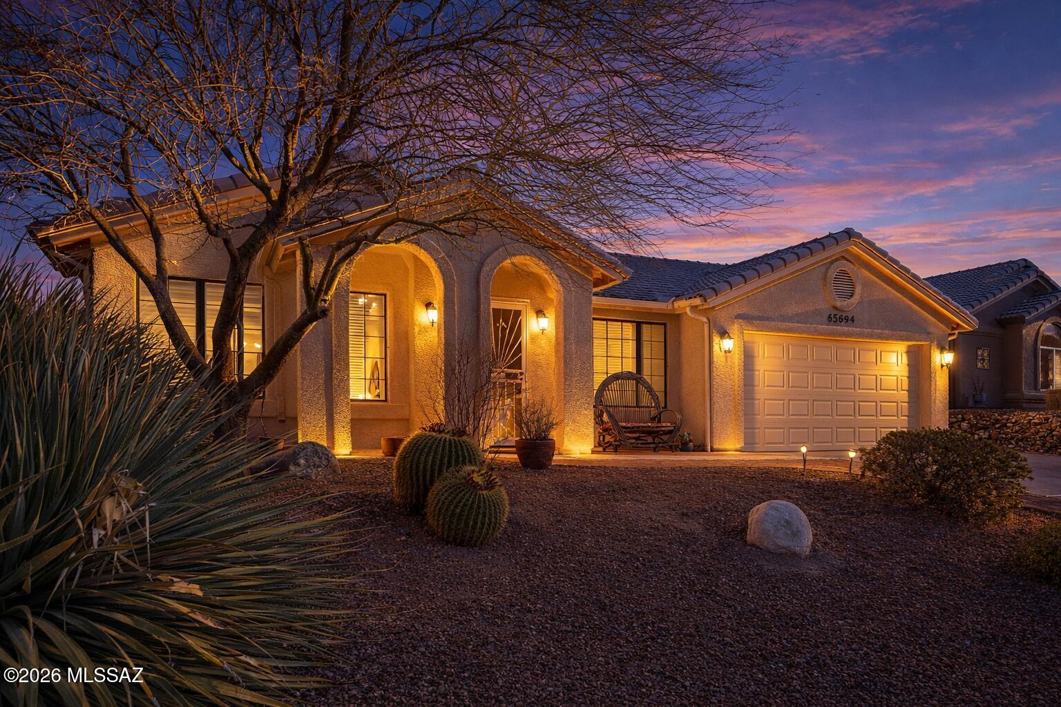 Effecient Loma Model nestled on a quiet street with an oversized rear yard. This well-maintained home features elegant tile flooring throughout the main living areas, with cozy carpeting in the second bedroom. The spacious great room boasts vaulted ceilings and an abundance of natural light. Additional highlights include a comfortable guest room with a built-in Murphy bed, a full hall bath, and a generously sized laundry room with a utility sink and ample storage. Hot water recirculation pump and a Trane HVAC system add to the home's comfort and efficiency. Located in SaddleBrooke, an award-winning 55+ community! Call today for a private showing!