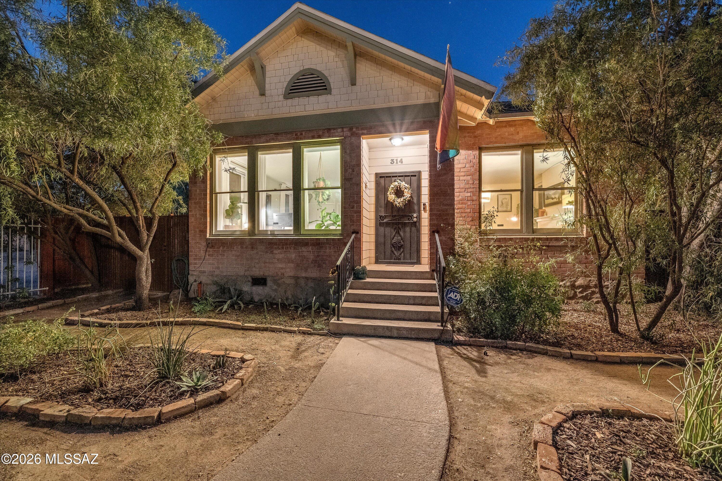 Get ready to fall in love with this 1907 Historic Brick beauty! Perfectly blending historic soul with modern convenience. The main house features 2 spacious bedrooms & 1.5 baths, original hardwood floors, a cozy fireplace, and newer HVAC system. The backyard features 2 rain water harvesting tanks, a gazebo for relaxing or entertaining, and plenty of space to enjoy. Behind the main home sits a fully renovated guest house complete with a private entrance and dedicated parking, perfect for visitors or rental income. Enjoy a fantastic location across from Catalina Park and a short stroll from living in the vibrant energy of 4th Avenue and the University of Arizona. This is more than a home, it is a piece of history.