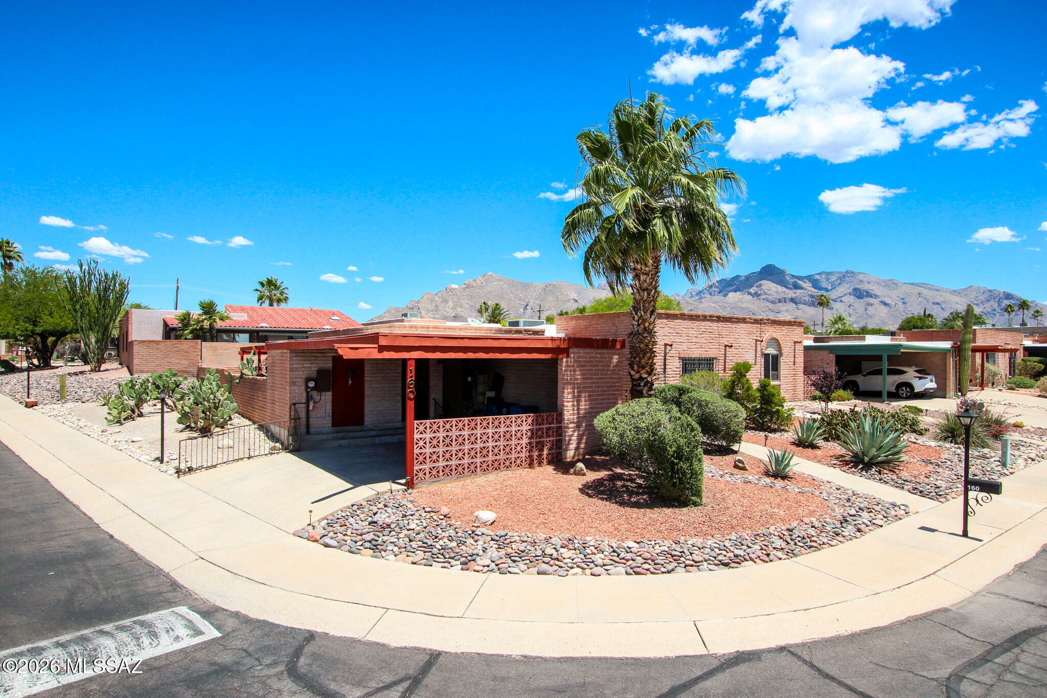 Charming 2bed/2bath, 1,542 sq ft TH in the La Serena community. This single level home features solid slump block construction, a covered patio, and a 2-car carport a low, care landscaping and a quiet neighborhood with convenient access to Oracle Rd and nearby shopping, dining, and amenities. Built in 1973, the home offers spacious rooms and a functional layout with central AC and forced air heat. Community pool access and a prime Northwest Tucson location make this a great opportunity for comfortable, low maintenance living. A little bit of TLC will go a long way with this one!!
