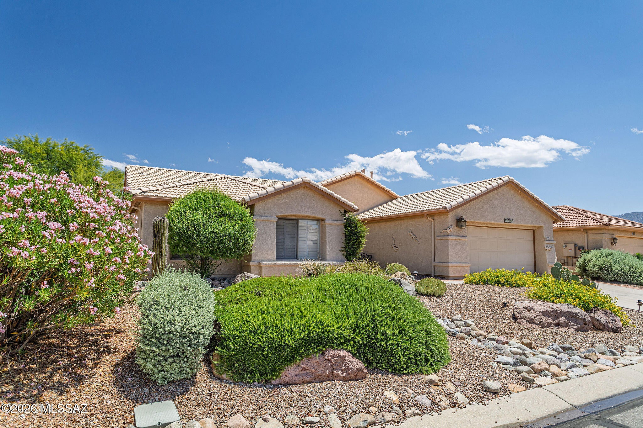 Located in the prestigious active adult community of SaddleBrooke, this expanded south-facing Montana model offers 3 bedrooms plus a den with beautifully updated finishes throughout. The remodeled kitchen features slab granite countertops, custom cabinetry, under-cabinet lighting, custom backsplash, undermount sink, and stainless steel appliances. Wood flooring flows through the living room, family room, and den, while custom plantation shutters and window treatments add warmth and elegance throughout the home. Designed for both comfort and entertaining, the home offers two spacious living areas, including a family room with built-in entertainment center and cozy gas fireplace. The upgraded bathrooms and thoughtfully remodeled interior create a move-in ready home with SaddleBrooke is one of Southern Arizona's premier resort-style active adult communities, located in the Catalina Foothills just north of Tucson at nearly 3,500 feet elevation, offering cooler temperatures and year-round outdoor living. Residents enjoy multiple golf courses, fitness centers, swimming pools, tennis and pickleball courts, clubhouses, restaurants, social clubs, and endless community activities.