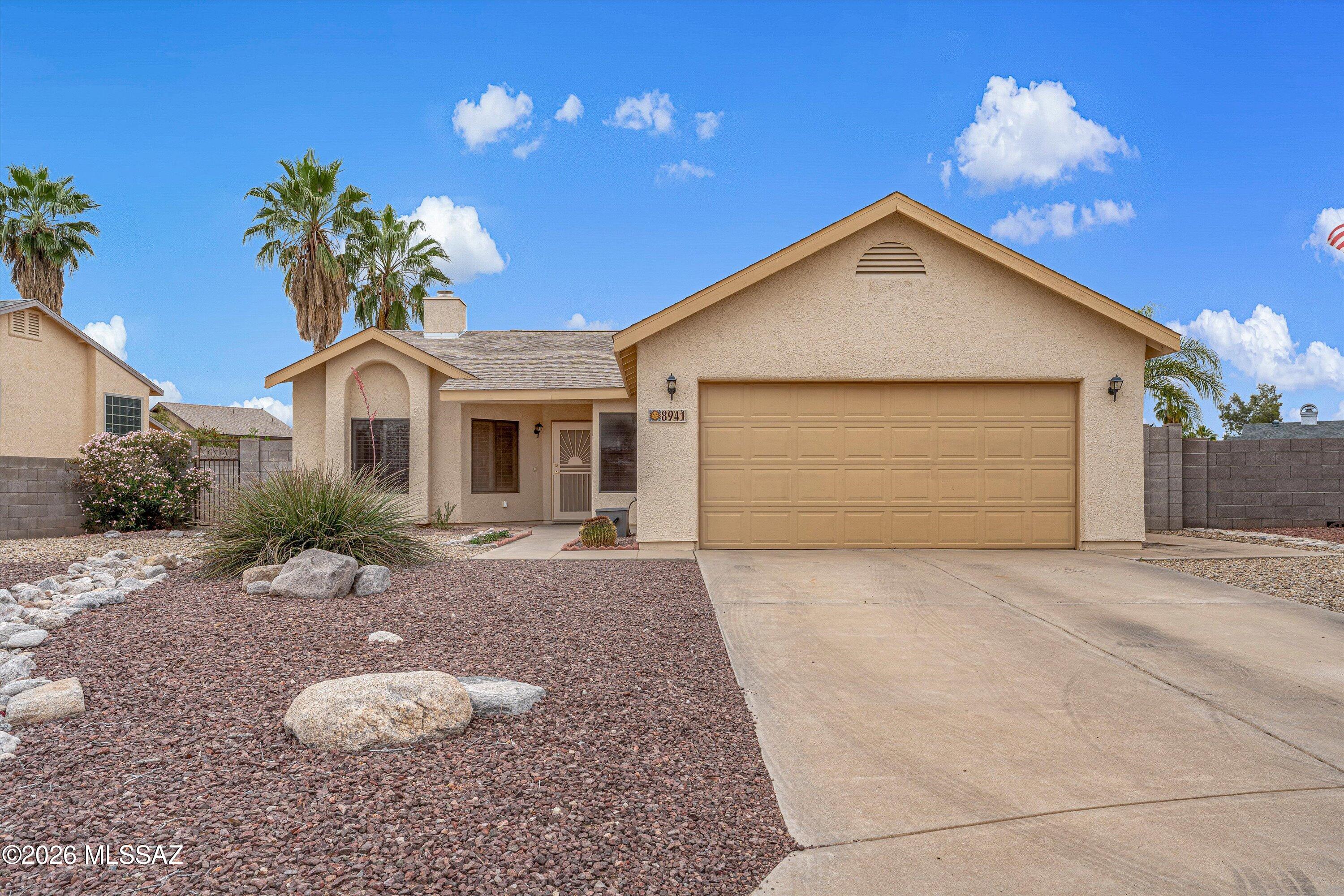 Welcome to this charming and meticulously cared-for 4BD/2BA,1677sqft home tucked away on a quiet cul-de-sac in the heart of the Northwest! Perfectly positioned for those seeking privacy and a traditional feel, this home offers a thoughtful layout that balances cozy living spaces with plenty of room for everyone. Upon entering, you are greeted by a welcoming tiled living room that flows naturally into the heart of the home. Unlike modern open-concept designs that can feel loud, this floor plan offers distinct, intentional spaces, perfect for a quiet home office setup or intimate family dinners. The eat-in kitchen is a delight, featuring beautiful cabinetry and a dedicated dining area that opens directly to the backyard, making indoor-outdoor transitions a breeze. The four bedrooms provide ample space and flexibility. The primary suite serves as a peaceful retreat, complete with a primary bath that features a relaxing soaking tub, dual vanities, and a separate shower--offering a spa-like experience at the end of a long day. Step outside to discover a generously sized backyard that is a true blank canvas for your desert dreams. Mature shade trees provide a cool canopy over the expansive yard, while the shaded patio is the ultimate spot to enjoy Tucson's famous colorful sunsets. With ample yard space, you have the freedom to create a poolside oasis, a custom play area, or a  garden. This home offers a fantastic opportunity to live in a well-established neighborhood just minutes from the loop, dining, and shopping!