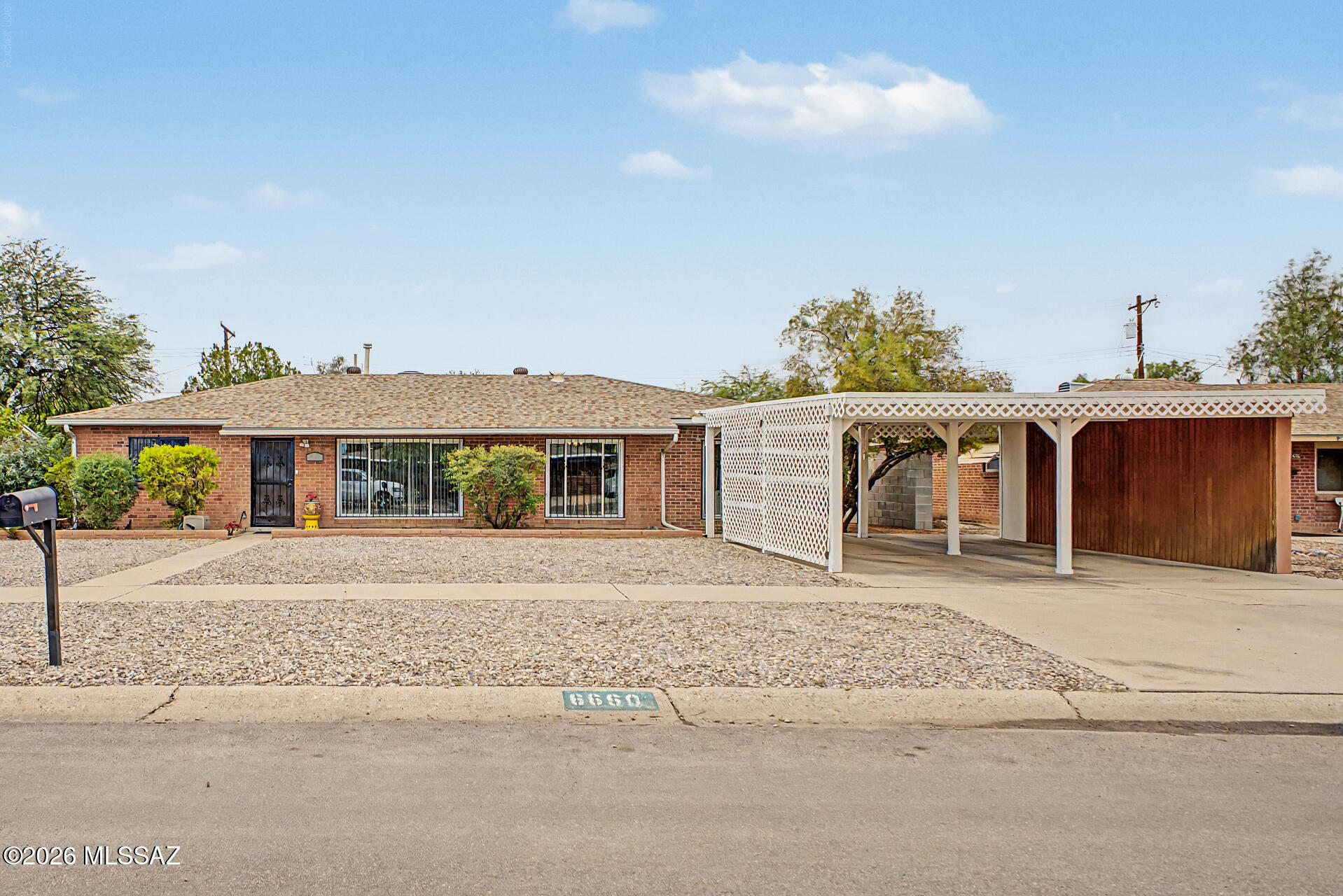 Charming UPDATED mid-century modern BRICK 3/2 home + office/craft room in desirable east side neighborhood. Separate family/living rms. Gorgeous built-in cabinetry. Brand NEW PEX PLUMBING, water heater, bathroom updates, paint, NEWER HVAC, kitchen, dual-pane windows, wood-like tile/vinyl flooring THROUGHOUT. PLUS 2-CAR CARPORT, pool-size yard w/6ft masonry fencing, alley access, large shed & covered patio, security doors/windows, AL fascia, mature trees, decorative gravel. HOME WARRANTY. First time this FAMILY HOME has been on market in nearly 50yrs! Walk to Kellond Elem school/family-friendly Palo Verde Park w/basketball, dog park, tennis, pickleball, pool/splash pad, sports fields, BBQs; SO MUCH FUN! Close to Park Mall, St Joseph's Hospital. NO HOA! Don't miss out on this amazing home.