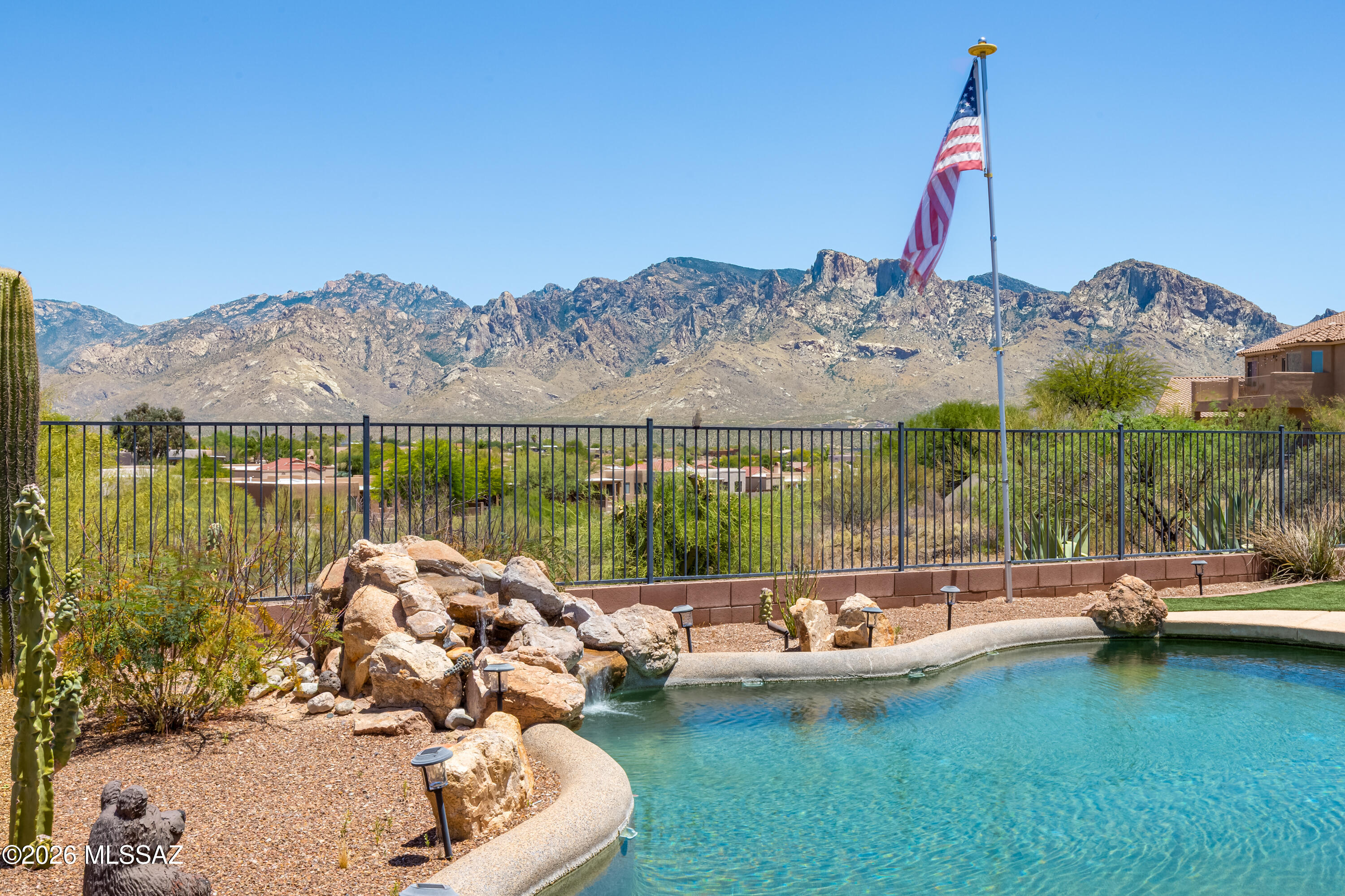 Located in Tangerine Terrace in Oro Valley, this spacious 3BR, 2½BA two-story home, built in 2007 w/2,473sf of living space on a premium lot backing to a natural arroyo with unobstructed Catalina Mountain views. Complete with a private pool, this home delivers the best of Arizona indoor-outdoor living. Designed for both everyday living and entertaining, the main level features multiple living spaces including a formal living room, separate dining room and an open-concept kitchen that flows seamlessly into the family room and breakfast nook. The kitchen is centrally positioned, creating a natural gathering space with easy access to the covered patio ideal for indoor-outdoor living. A powder room, laundry area, and additional storage/hobby space off the two-car garage add convenience and flexibility. Upstairs, the home offers a well-balanced layout with a spacious primary suite featuring an en-suite bath and a private sitting room, perfect for a home office, reading retreat or workout space. Two additional bedrooms share a full bath, while a large game room provides the option for a fourth bedroom, media space, or flex room to suit a variety of needs. The backyard captures the true essence of Arizona living, with a refreshing pool, expansive patio areas, and breathtaking mountain views with no direct rear neighbors offering both privacy and a stunning natural backdrop. Interior features include ceramic tile flooring in main living areas, carpet in bedrooms, plantation shutters, and wood blinds throughout, creating a neutral canvas ready for a buyer's personal style. Situated within the Tangerine Terrace community, this home is conveniently located near Oro Valley's premier amenities including the Oro Valley Community Center, golf courses, parks and the extensive Loop trail system. Outdoor enthusiasts will appreciate easy access to Catalina State Park and Honey Bee Canyon for hiking and exploring. Located within the highly regarded Amphitheater School District, including Ironwood Ridge High School, this home offers both lifestyle and location. This is a rare opportunity to own a view lot with a flexible floor plan in one of Oro Valley's desirable communities offering space, views, and endless potential.