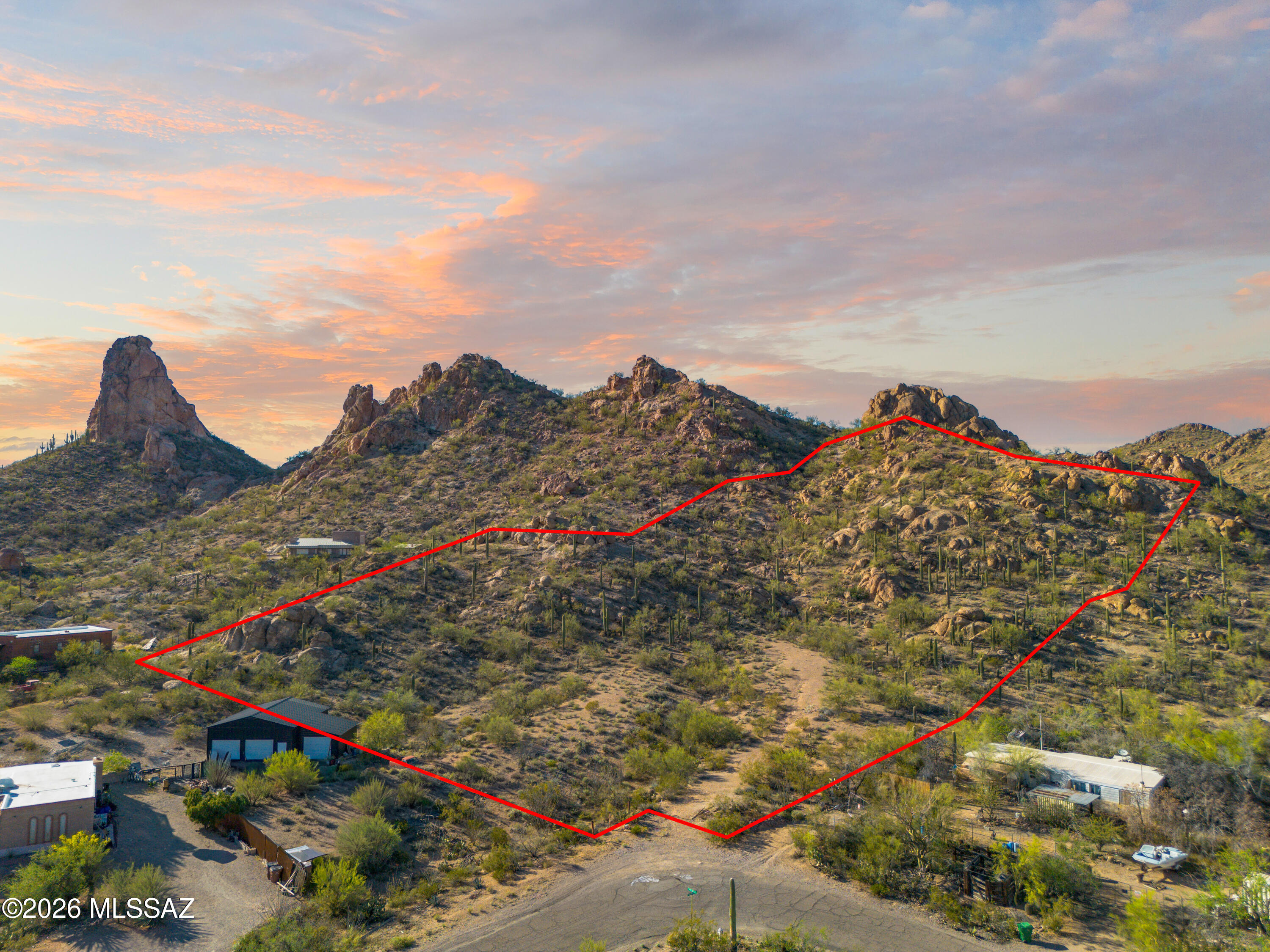 Exceptional location offers sweeping views to the south. Picturesque mountain peaks to the north are in your new back/front yard. Ideal retreat for those seeking tranquility & natural beauty of Tucson. 4.98-acre residential site ideal for building a luxury or starter home. Water at lot line. 1000 gallon Septic system pumped & certified 12/2023. Property survey 2023. Electric available. Schools, Shopping & Amenities in close proximity. Bring the Horses, RV's, Equipment & Toys. Come take a look and get ready to build. 
This is the ONE you have been looking for....