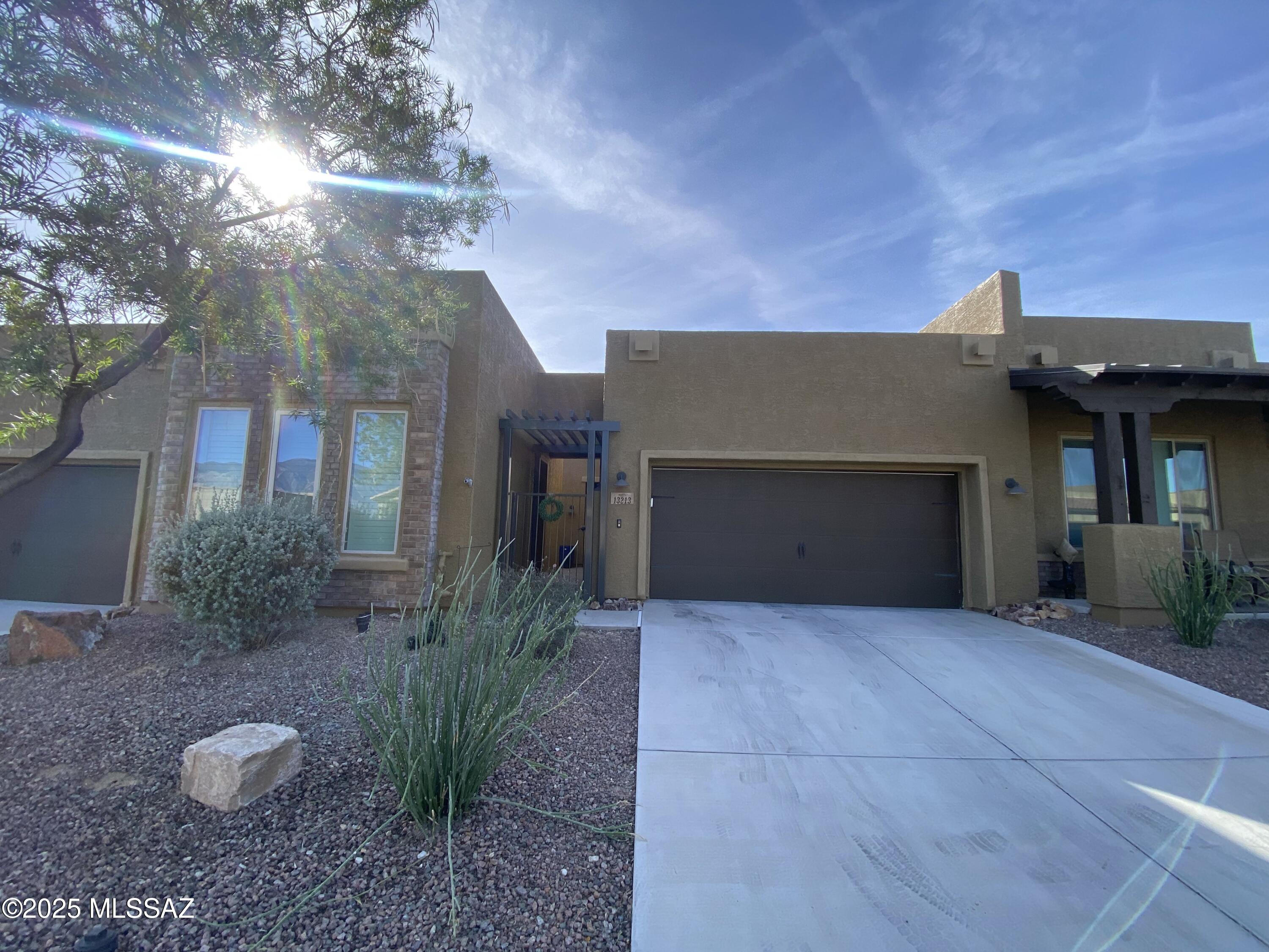 Featuring a private casita and located in the gated Ridgeview Community, this home offers more than just a place to liv, it's a lifestyle. Enjoy breathtaking views and a thoughtfully designed floor plan that blends comfort, elegance, and accessibility. Inside, you'll find 10-foot ceilings, plantation shutters, and a spacious kitchen complete with a gas cooktop and oversized granite island. The main home offers a desirable primary suite + den layout, while the separate casita provides endless possibilities for guests, work, or multigenerational living. Seamless indoor-outdoor living awaits with a beautifully landscaped backyard and a welcoming front courtyard. Designed with care, the home includes ADA adaptations in the primary suite along with a ramp for easy access. Community amenities include a pool, spa, picnic area, firepit, and green space, all just steps from your door.