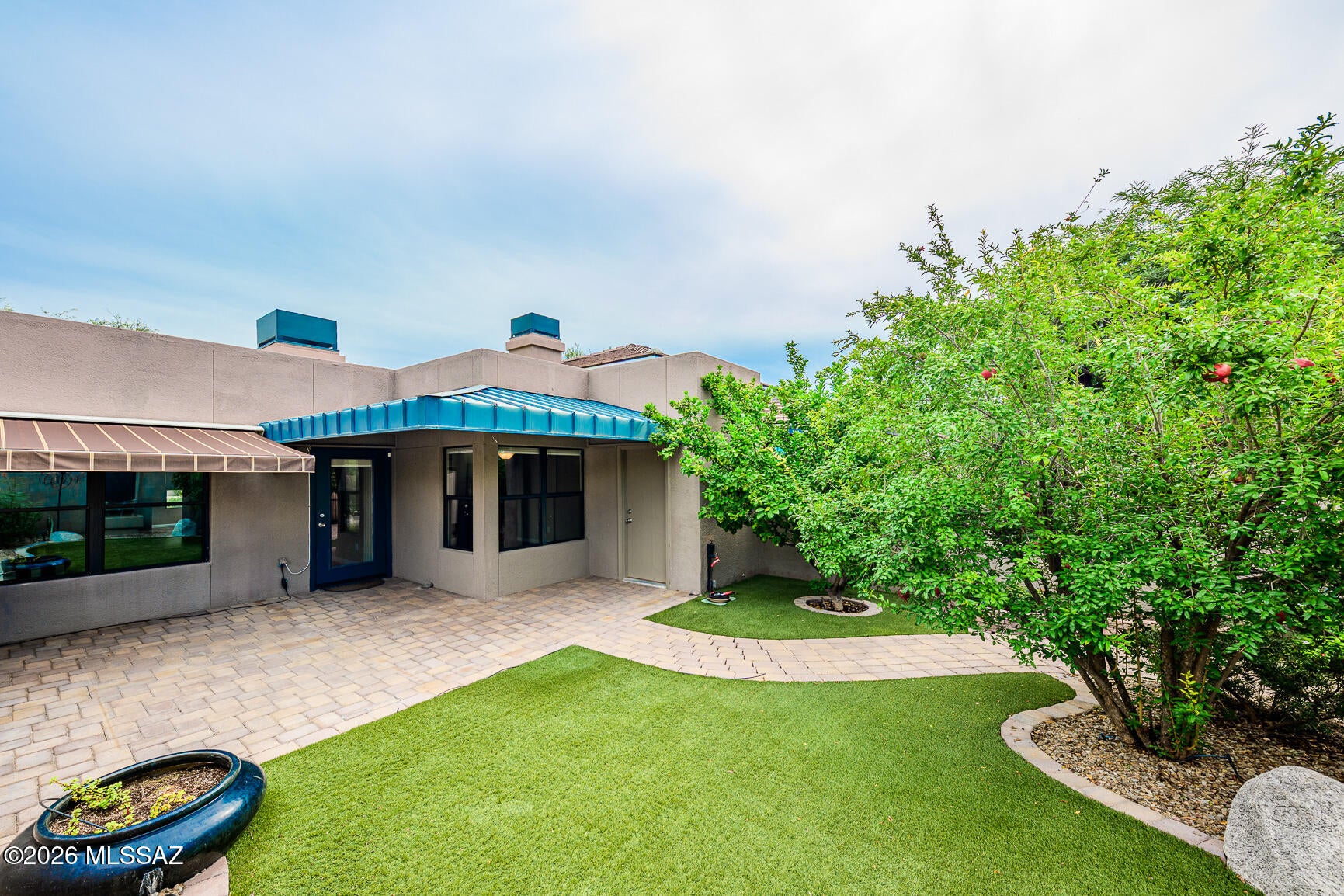 Beautifully maintained ground-level casita in the highly desirable Greens @ Ventana Canyon! Single-story home features a split floor plan, granite counters, tile & laminate floors, stainless steel appliances & new Bosch dishwasher. No upstairs neighbor! Enjoy the spacious, private backyard w/retractable patio awning, artificial turf, paver walkway, raised flower bed, and mature citrus and pomegranate trees. Relax on the patio to the soothing sounds of the fountain and flowing water. The Greens offers 3 pools, 2 hot tubs, BBQs, clubhouse & fitness center. HOA includes trash/recycling, security patrol, fire protection, & exterior maintenance of the unit, roof and streets. Agent is related to seller. Enjoy hiking, Sabino Canyon Rec Area, shopping & some of Tucson's best restaurants.
